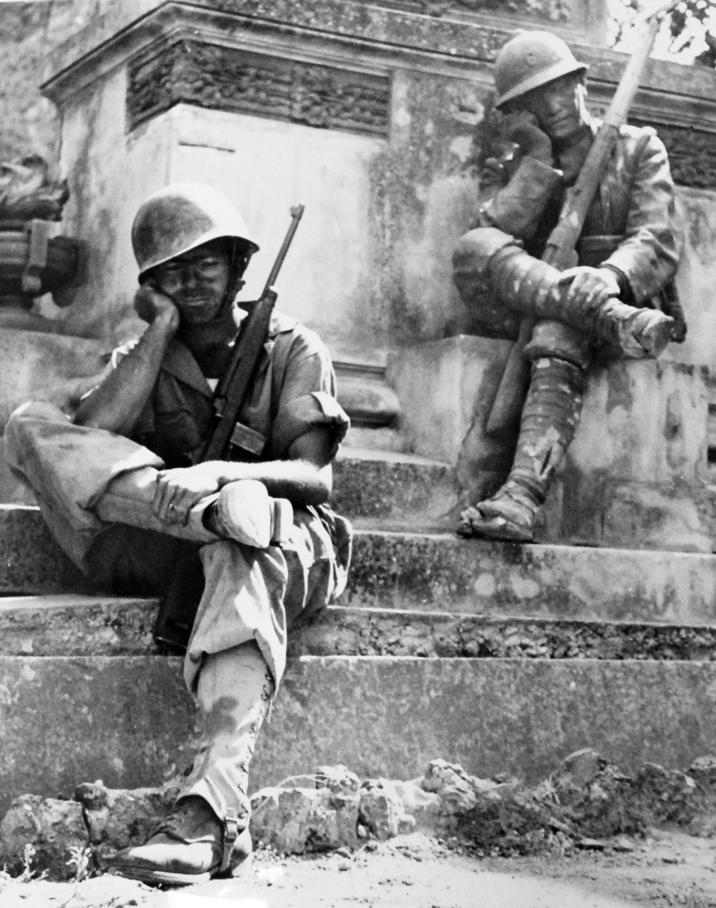 LC-USZ62-98977: Operation Husky - Invasion of Sicily, Italy, July-August 1943.  Study in Still Life.  Tired and foot-weary from his march to Brolo, Sicily, Sergeant Norwood Dorman falls into the pose of the statue in this memorial to the Italian soldier of World War I.     U.S. Army Photograph.  Photographed through Mylar sleeve.  Courtesy of the Library of Congress:  Lot-805. (2015/10/30).