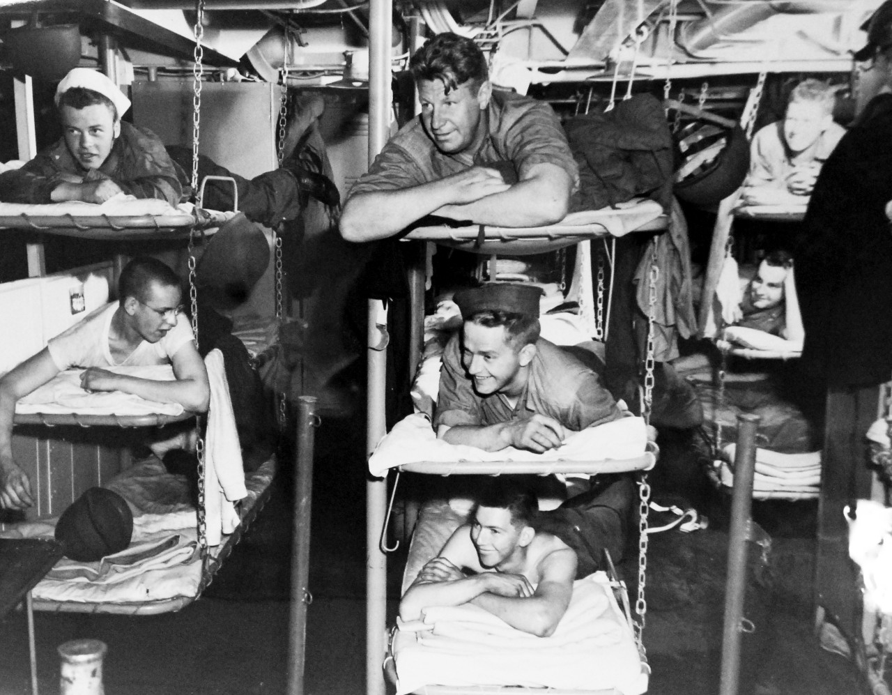 LC-USZ62-98979: Operation Husky - Invasion of Sicily, July-August 1943. Crew Quarters Were Comfortable.  With all available space utilized aboard the LST (landing ship, tank), crew quarters are nevertheless comfortable.  These North African bound amphibious forces take it easy during a leisure moment. Photograph released July 13, 1943.  Photographed through Mylar sleeve. U.S. Navy Photograph. Courtesy of the Library of Congress:  Lot-805. (2015/10/30).