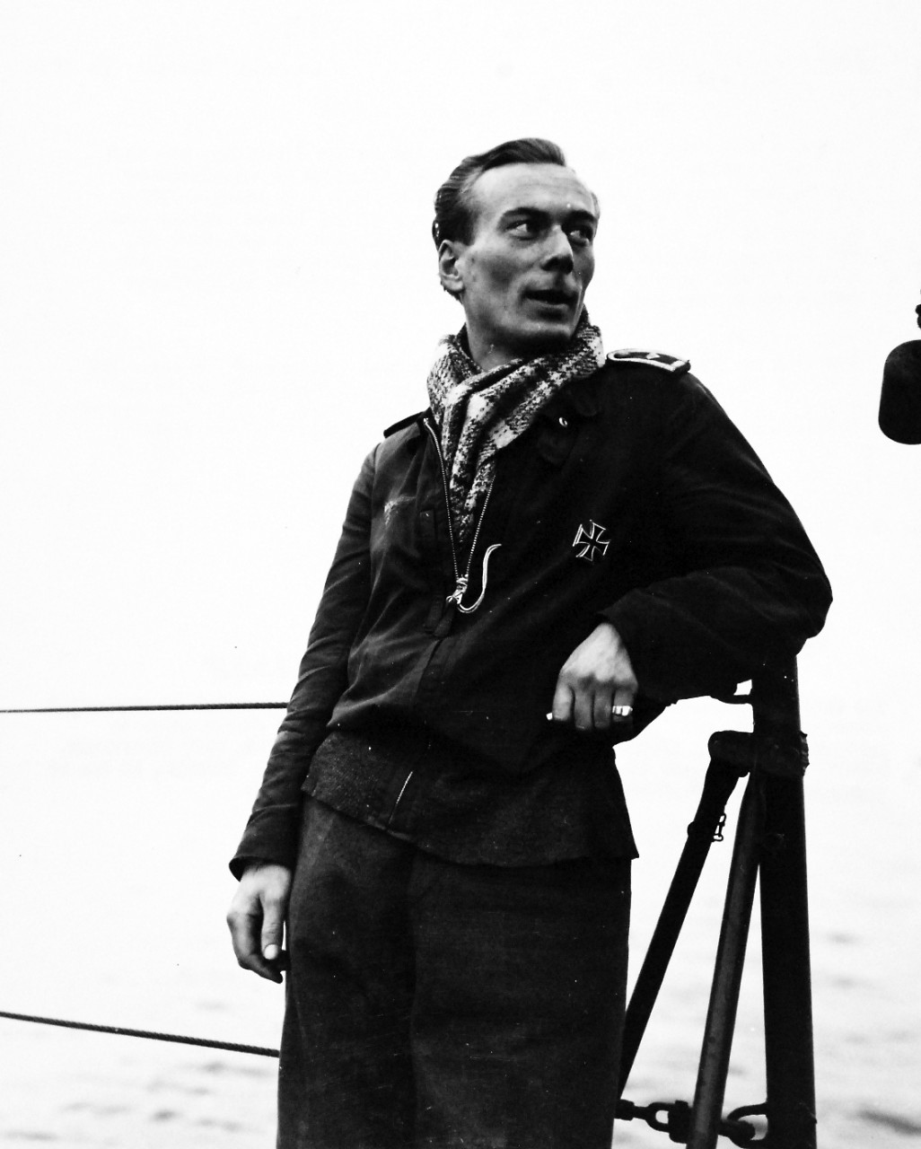 80-G-54414:   Battle of Anzio, January-June 1944.   German Prisoners at the Anzio Beachhead below Rome, on their way to prison camp.  Sporting an Iron Cross on his jacket, this Nazi prisoner of war poses for a camera study onboard the LST bearing him to a behind-the-lines prison camp.  A veteran of 260 missions in less than 2 years, this English-speaking fighter pilot is 27 years old – he still believed in the ultimate Nazi victory.  Photograph released February 17, 1944.  Official U.S. Navy photograph, now in the collections of the National Archives.  (2016/06/28).