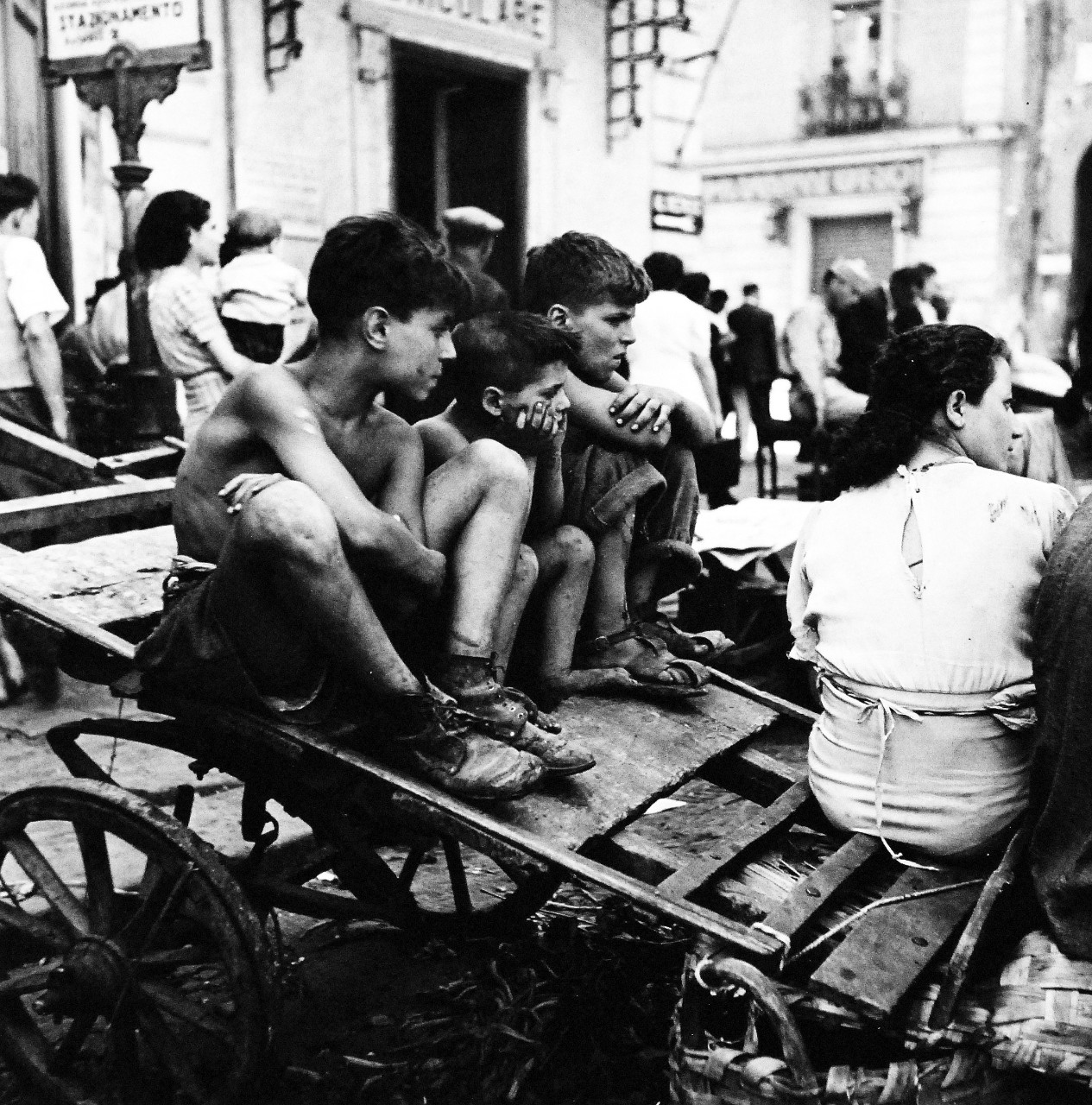 80-G-474133:   Naples, Italy, August 1944.   Children in Naples, Italy.   Boys on cart.  Steichen Photograph Unit:  Photographed by Lieutenant Wayne Miller, August 1944.  TR-11320.  Official  U.S. Navy Photograph, now in the collections of the National Archives. (2015/12/08). 