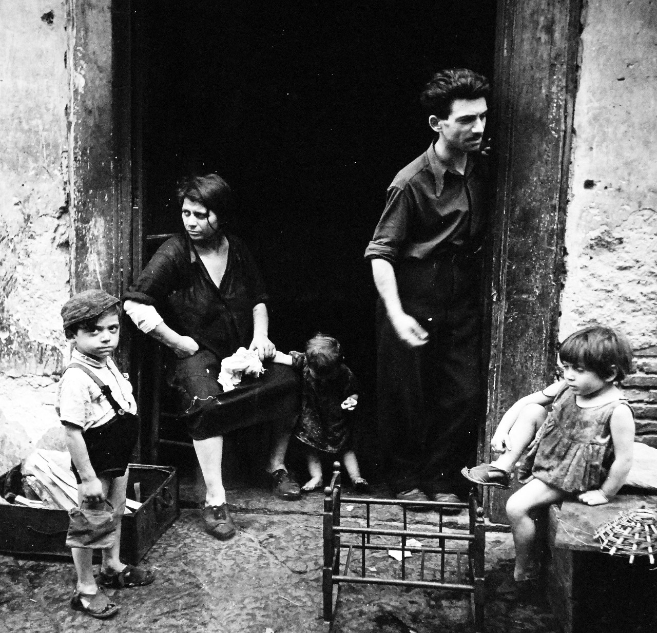 80-G-474143:   Naples, Italy, August 1944.   Children play while mother works. Steichen Photograph Unit:  Photographed by Lieutenant Wayne Miller, August 1944.  TR-13030.  Official U.S. Navy Photograph, now in the collections of the National Archives. (2015/12/08). 