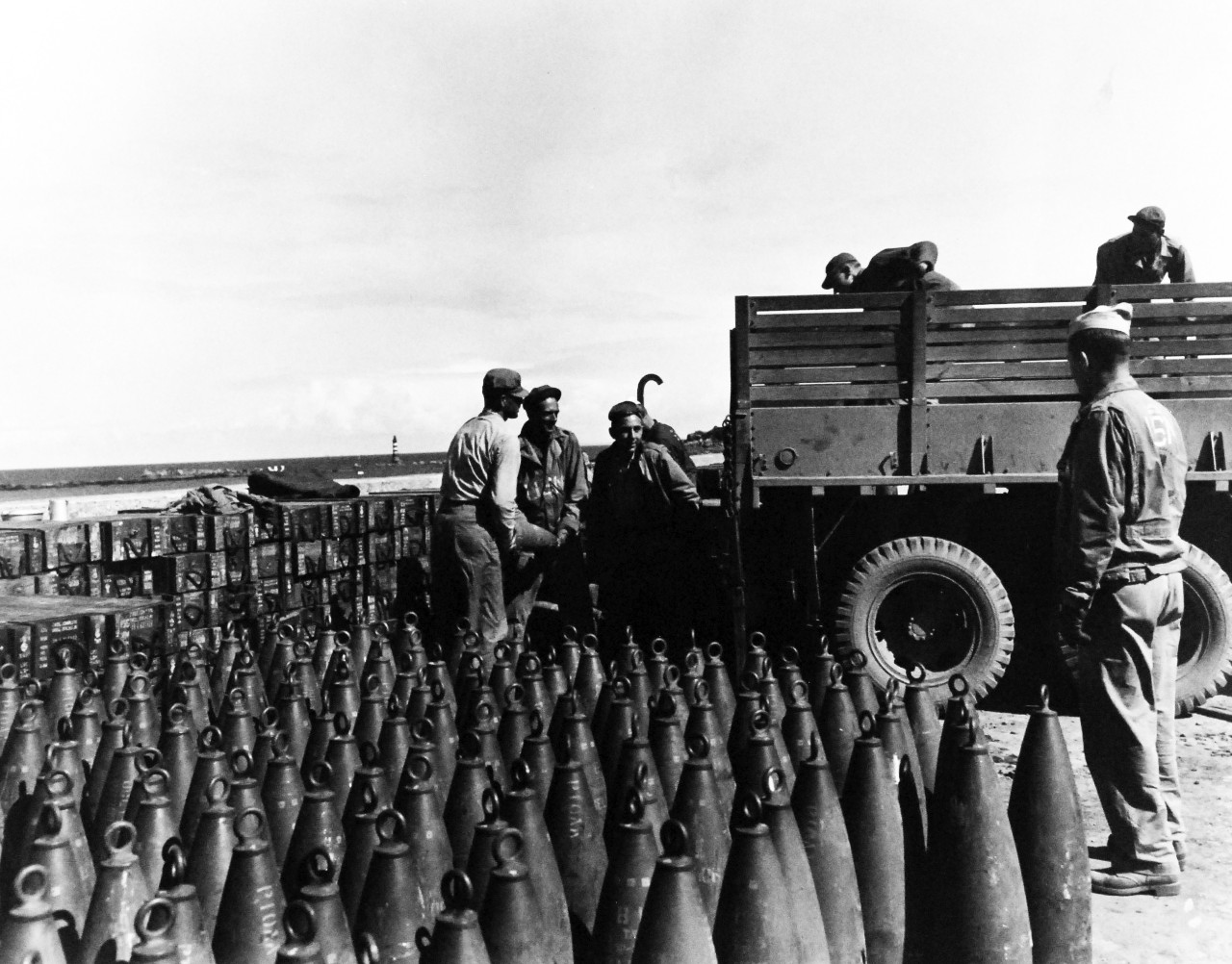 80-G-247135:   Invasion of France, Roscoff, August-September 1944.    US Navy Seabees loading ammunition at Roscoff, France, for battle of Brest.   Note 155MM Shells.  Photograph received September 1944.   Official U.S. Navy Photograph, now in the collections of the National Archives.   (2014/3/12).  