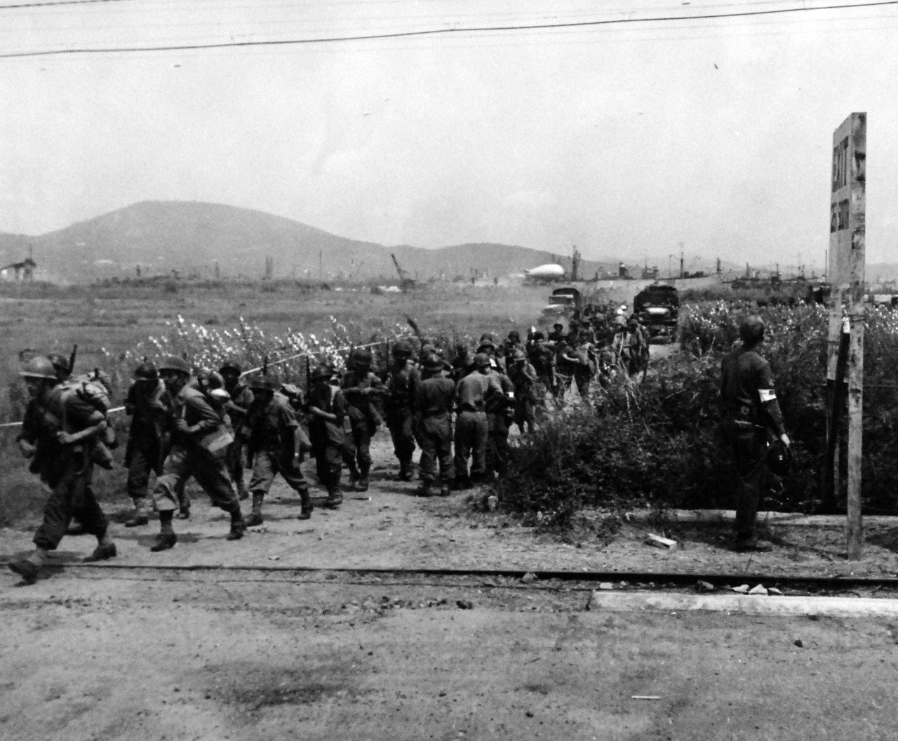 80-G-242118:   Invasion of Southern France, August 1944.     French troops landing in Southern France break into a dog trot in their eagerness to join their countrymen at the front.   Photographed by crewmember of USS Catoctin (AGC 5), 16 August 1944.  .  Official U.S. Navy Photograph, now in the collections of the U.S. Navy.   (2014/5/22).