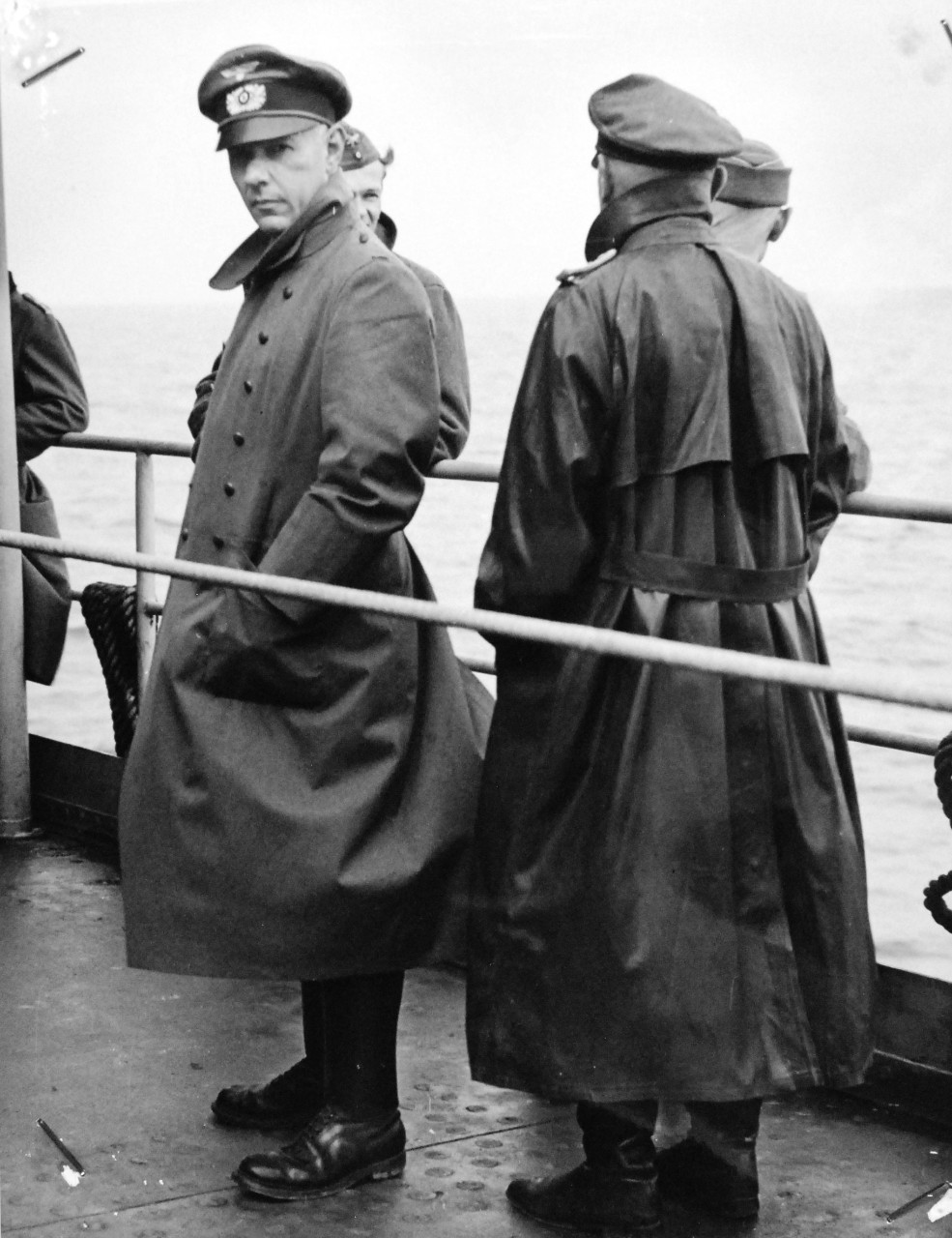 26-G-2576:  Normandy Invasion, German Prisoners,  June 1944.   German Officers aboard a Coast Guard Manned Transport.   There’s definitely nothing shabby about the clothing of these captured German officers as they “take the air” on a Coast Guard manned transport en route to the United States, June 1944.  Official U.S. Coast Guard Photograph, now in the collections of the National Archives.   (2015/5/19).  