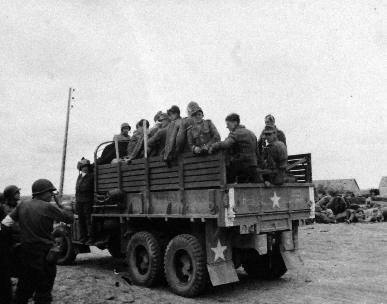 80-G-252668:   Normandy Invasion, German Prisoners, June 1944.  German prisoners captured by Airborne Division in truck on French Beach, 8 June 1944.   Official U.S. Navy Photograph, now in the collections of the National Archives.   (2014/10/28). 