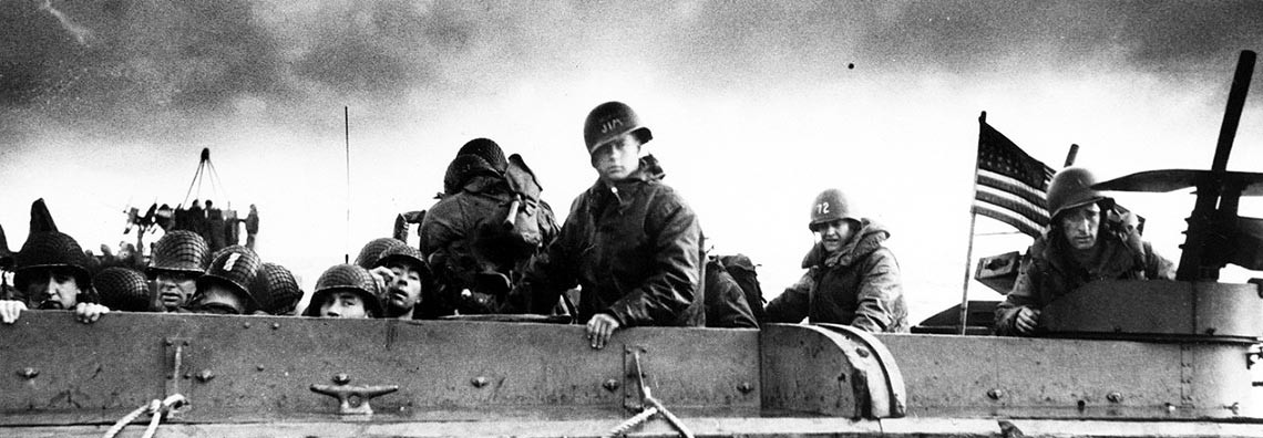 26-G-2349:   Normandy Invasion, June 1944.   Troops and crewmen aboard a Coast Guard manned LCVP as it approaches a Normandy beach on D-Day, June 6, 1944.  U.S. Coast Guard Photograph, now in the collection at the National Archives.   