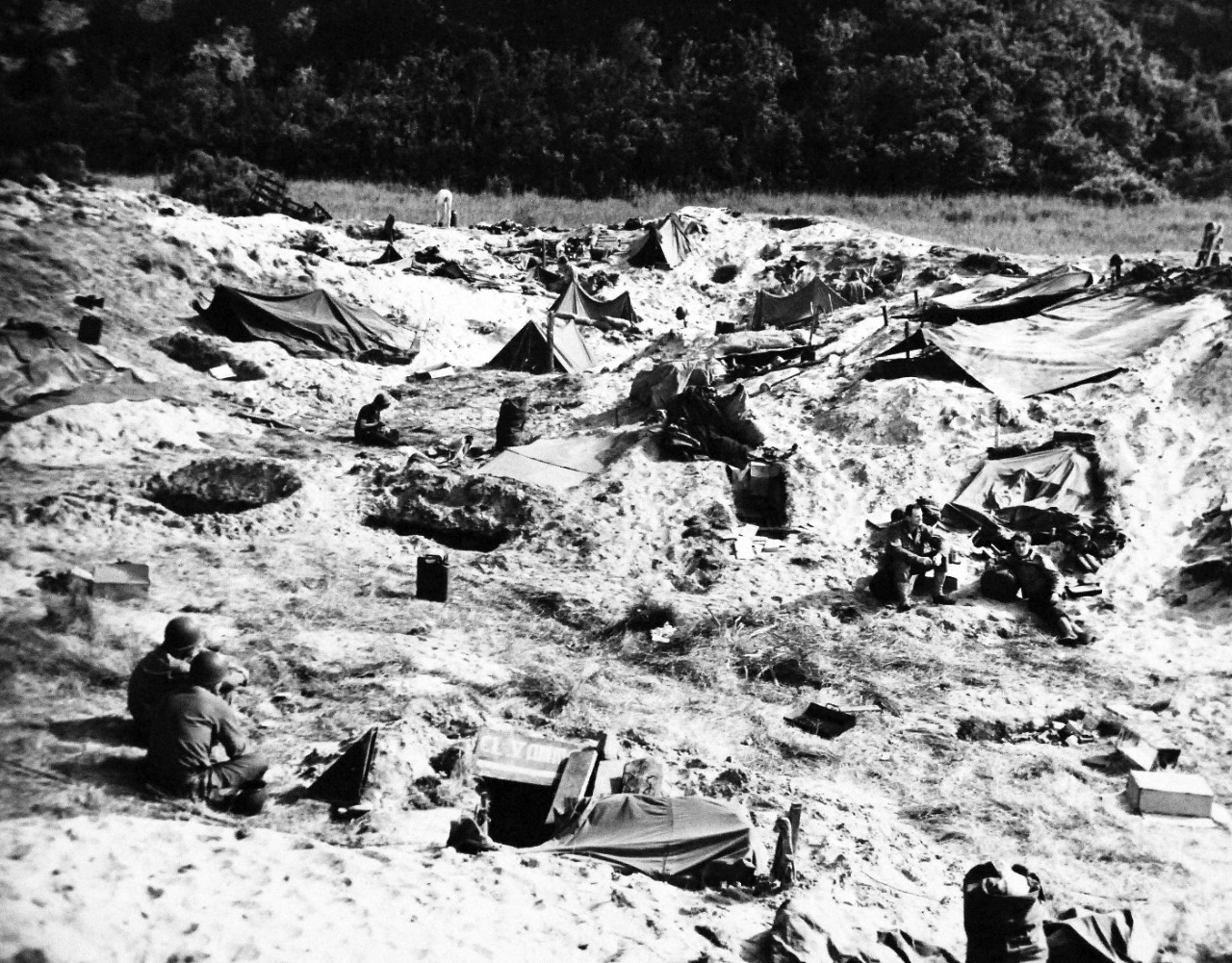 80-G-285226:  Normandy Invasion, June 1944. American troops “dug in” near beach of Normandy, France.  Photograph released November 7, 1944.  U.S. Navy photograph, now in the collections of the National Archives.  (2016/03/15).