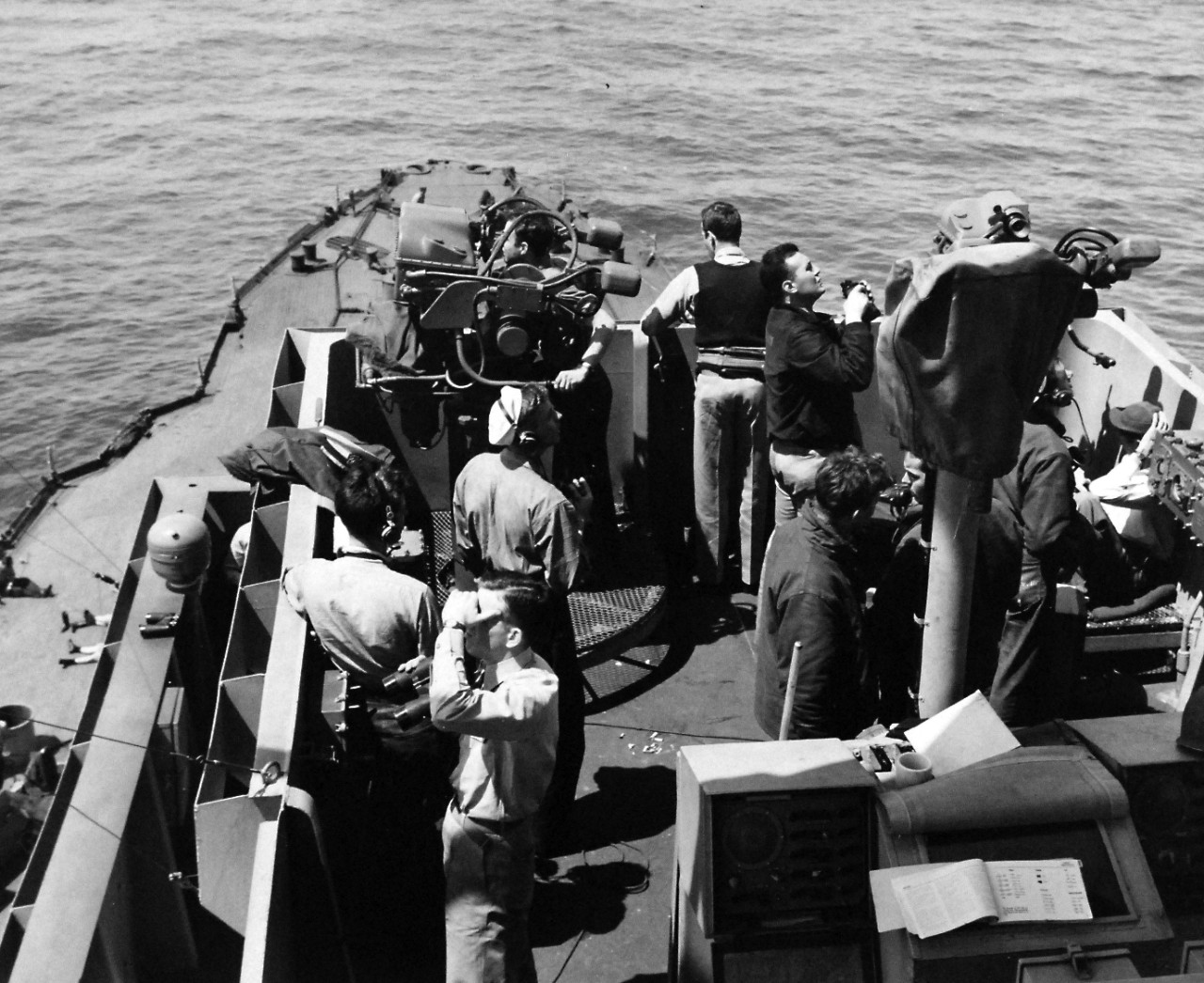 80-G-244200:  Normandy Invasion, U.S. Navy Ships, June 1944.    USS Arkansas (BB-33), officers and men, on the lookout for enemy planes during invasion of Normandy, France.  Photograph June 14, 1944.    Official U.S. Navy photograph, now in the collections of the National Archives.  (2016/10/04).