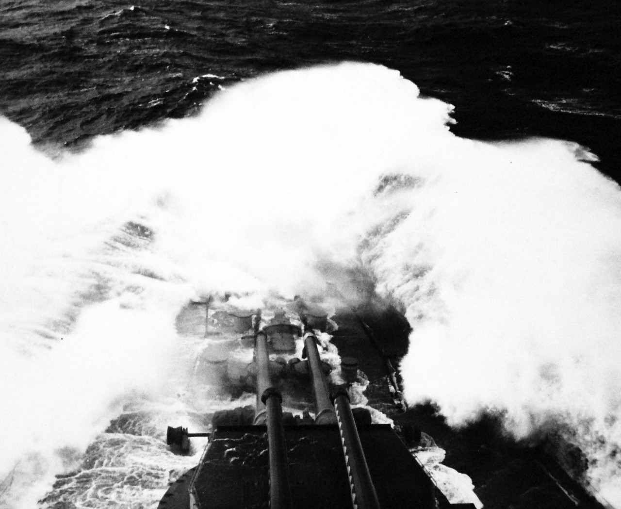 80-G-244235:  Normandy Invasion, U.S. Navy Ships, June 1944.    USS Arkansas (BB 33) takes some heavy water over her foc’sle.    Photograph released September 1, 1944.  Official U.S. Navy photograph, now in the collections of the National Archives.  (2016/10/04).