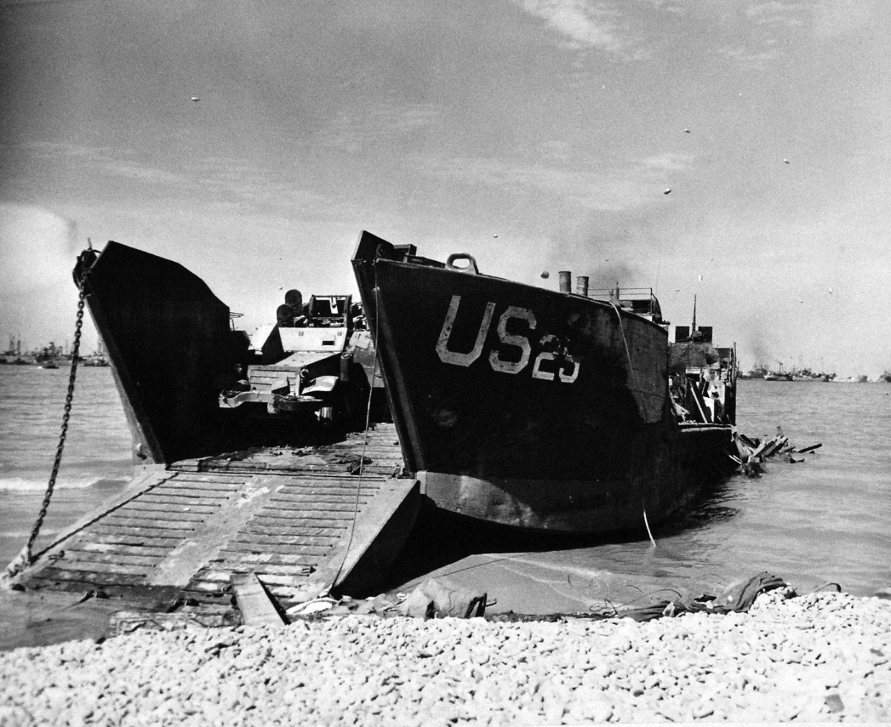 80-G-285210:  Normandy Invasion, U.S. Navy Ships, June 1944. USS LCT 25 unloading an armored car on Normandy Beach, France.  In background are Allied ships.  Photograph released November 7, 1944.  U.S. Navy photograph, now in the collections of the National Archives.  (2016/03/15).