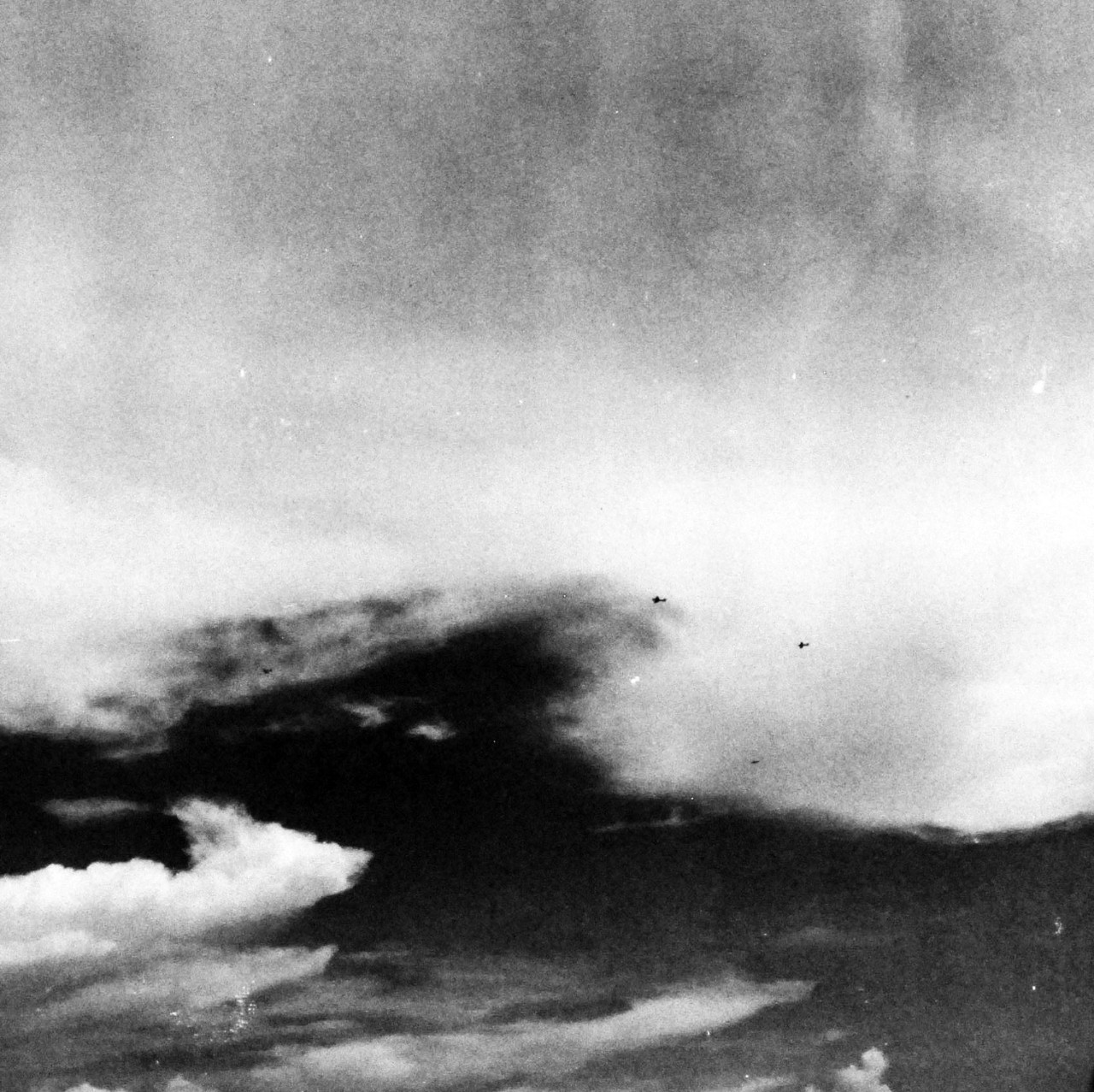 80-G-287528:   USS Kitkun Bay (CVE-71), October 25, 1944.  Japanese fighters break formation to make suicide dives on carrier escorts on US Fleet during the Battle of Leyte Gulf.  As seen from USS Kitkun Bay (CVE-71.  Official U.S. Navy photograph, now in the collections of the National Archives.  