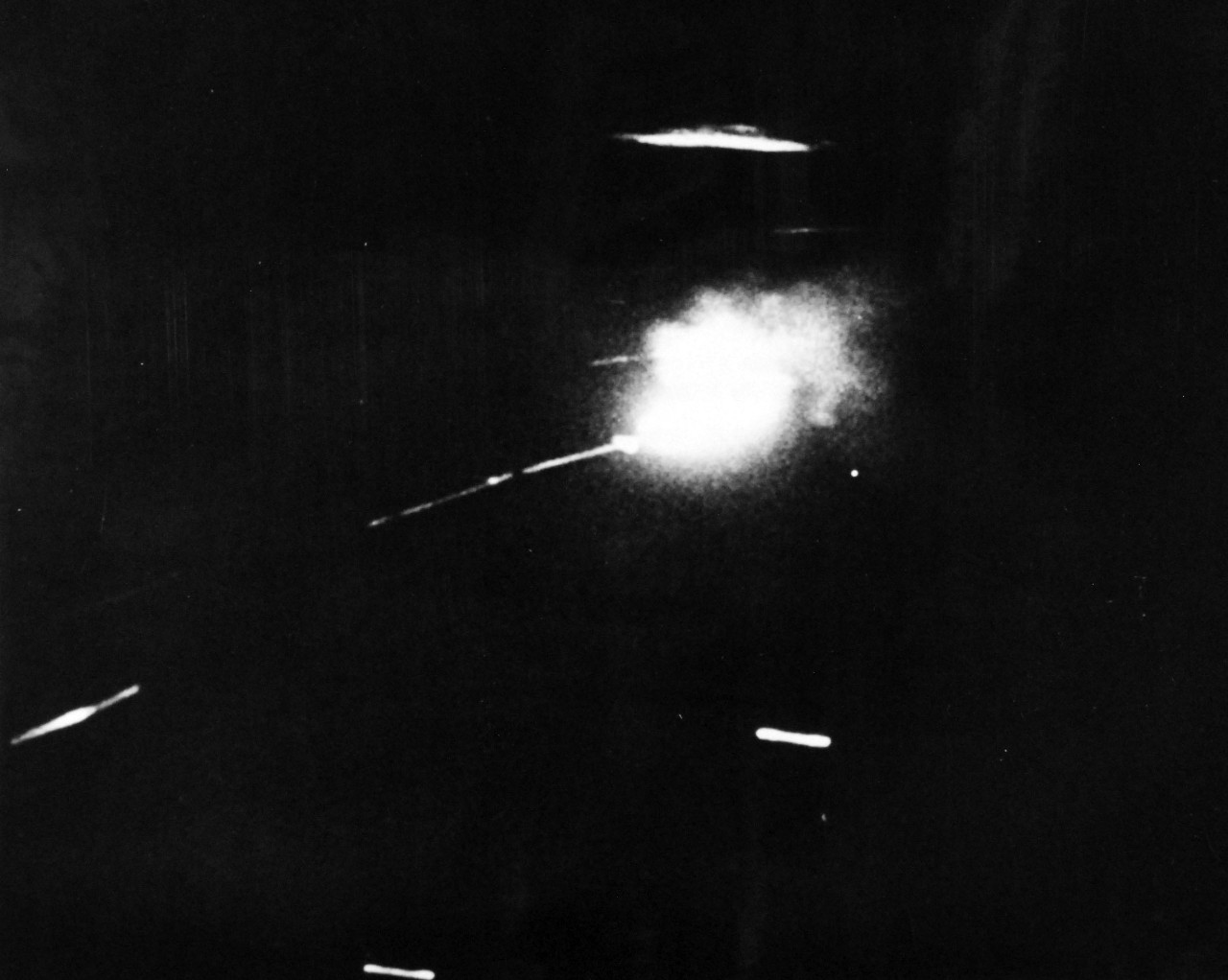 80-G-49874: Japanese Kamikaze Attack, July 1945. Stills from the U.S. Navy, Marines and Coast Guard film, “The Fleet That Come To Stay.”  Shown:  Hit and set aflame by U.S. Navy anti-aircraft fire, a Japanese Kamikaze plane becomes a ball of fire as it descends toward the sea off Okinawa.    Received July 19, 1945.   Official U.S. Navy photograph, now in the collections of the National Archives.  