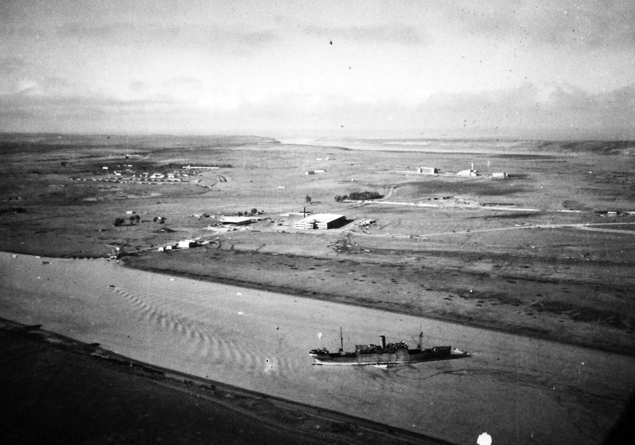 <p>80-G-37244:&nbsp; Operation Torch, Invasion of North Africa, November 1942.&nbsp;&nbsp;&nbsp; Port Lyantey, French Morocco, following Allied invasion, 11 November 1942.&nbsp;&nbsp; Note, seaplane hangar, shops, aircraft assembly plant and small section of the airport.&nbsp;&nbsp; Aerial photograph taken by aircraft from USS&nbsp;<i>Ranger</i>&nbsp;(CV 4), 11 November 1942.&nbsp; &nbsp;</p>
