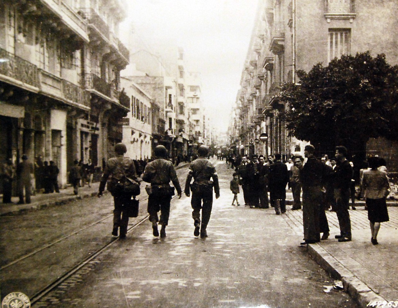 LC-Lot-11582-11: Operation Torch, November 1942. Americans walking down a street in Oran, North Africa, 1942.  U.S. Army Signal Corps Photograph SC-149963, released December 21, 1942.   Courtesy of the Library of Congress. Photographed through Mylar sleeve.  (2016/05/27).