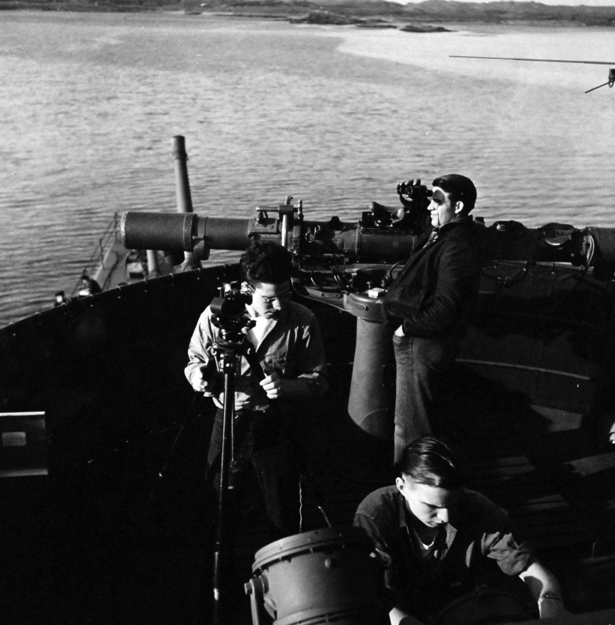 80-G-475668:  Aleutian Islands Campaign, June 1942 - August 1943.  Battle of Attu, May 11-29, 1943.  Aerologists aboard USS Casco (AVP-12) at Attu take reading with Theodolite.  Photographed released by the Steichen Photographic Unit:  Lieutenant Commander Horace Bristol, July 1943.    TR-5311.    U.S. Navy photograph, now in the collections of the National Archives.  (2015/11/17).
