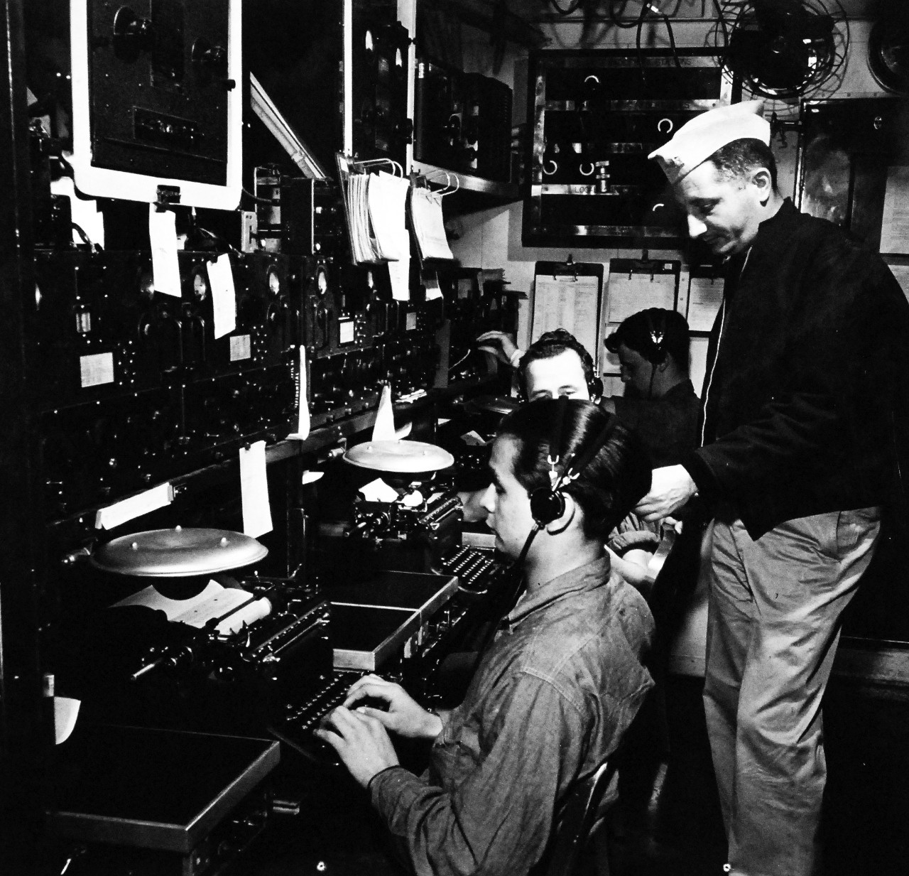 80-G-475697:  Aleutian Islands Campaign, June 1942 - August 1943.  Battle of Attu, May 11-29, 1943.  Communications headquarters aboard USS Casco (AVP-12) in Massacre Bay, Attu. Photographed released by the Steichen Photographic Unit:  Lieutenant Commander Horace Bristol, July 1943.    TR-5263.    U.S. Navy photograph, now in the collections of the National Archives.  (2015/11/17).