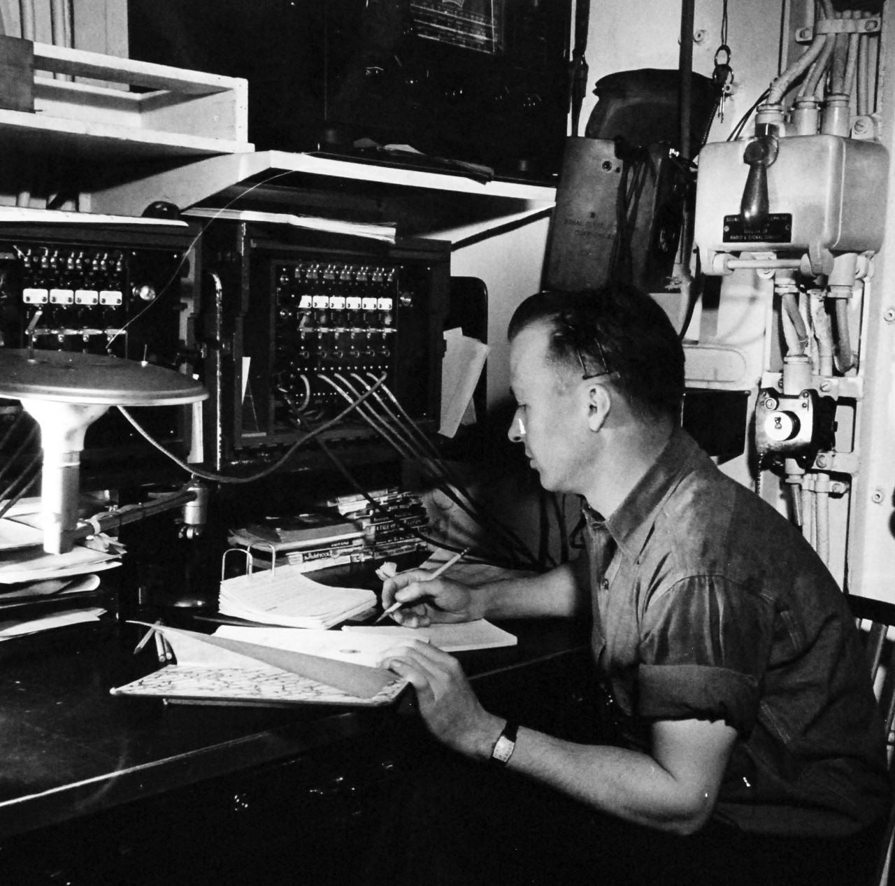 80-G-475698:  Aleutian Islands Campaign, June 1942 - August 1943.  Battle of Attu, May 11-29, 1943.  Telephone switchboard on USS Casco (AVP-12) serves as headquarters for all communication on Attu. Photographed released by the Steichen Photographic Unit:  Lieutenant Commander Horace Bristol, July 1943.    TR-5262.   U.S. Navy photograph, now in the collections of the National Archives.  (2015/11/17).