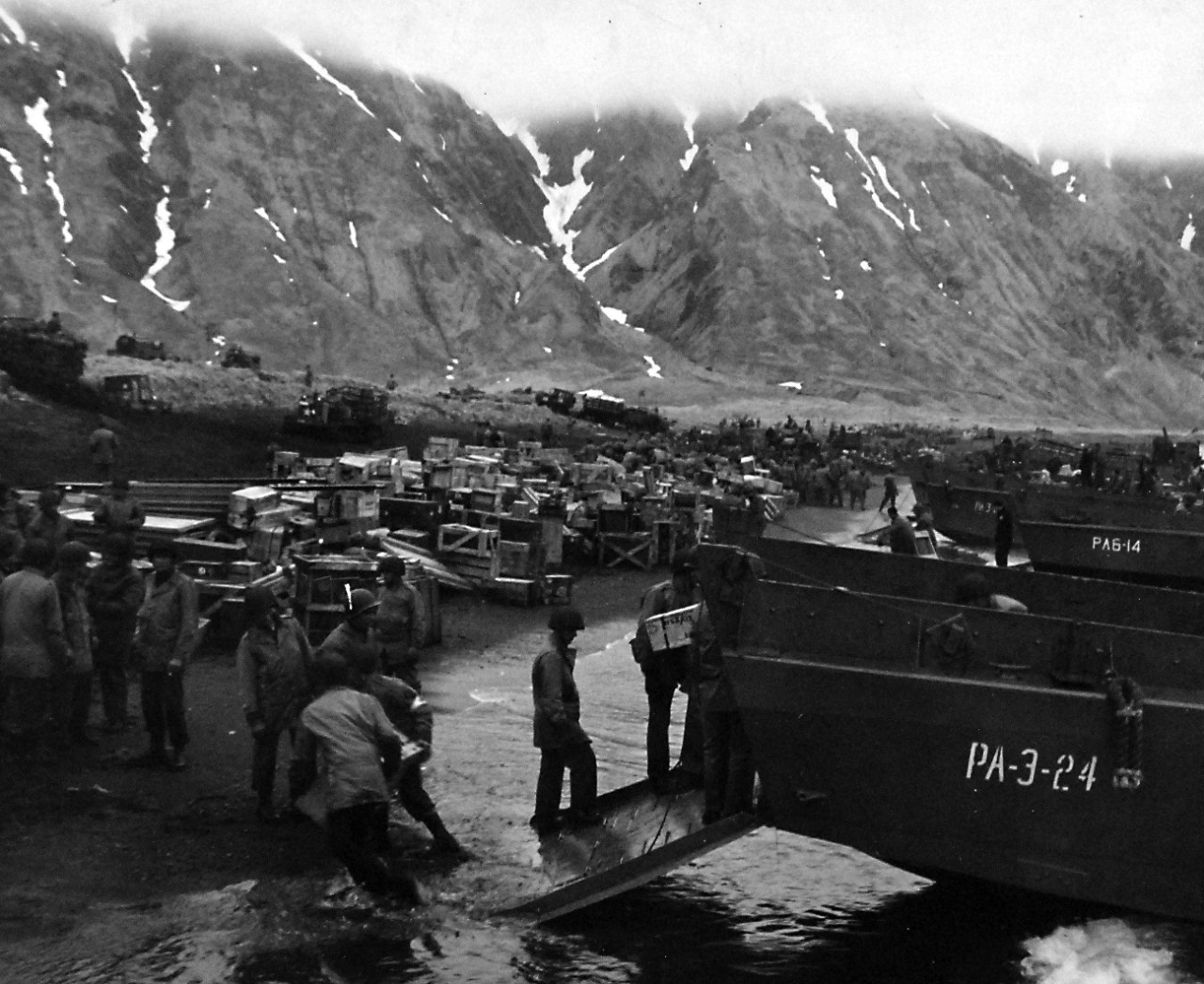 80-G-50921:    Aleutian Islands Campaign, June 1942 - August 1943.  Battle for Attu, May 1943.    Unloading supplies on invasion beachhead, Attu, on the day of the attack.   Photograph released May 14, 1943.    U.S. Navy Photograph, now in the collections of the National Archives.  (2016/05/10).