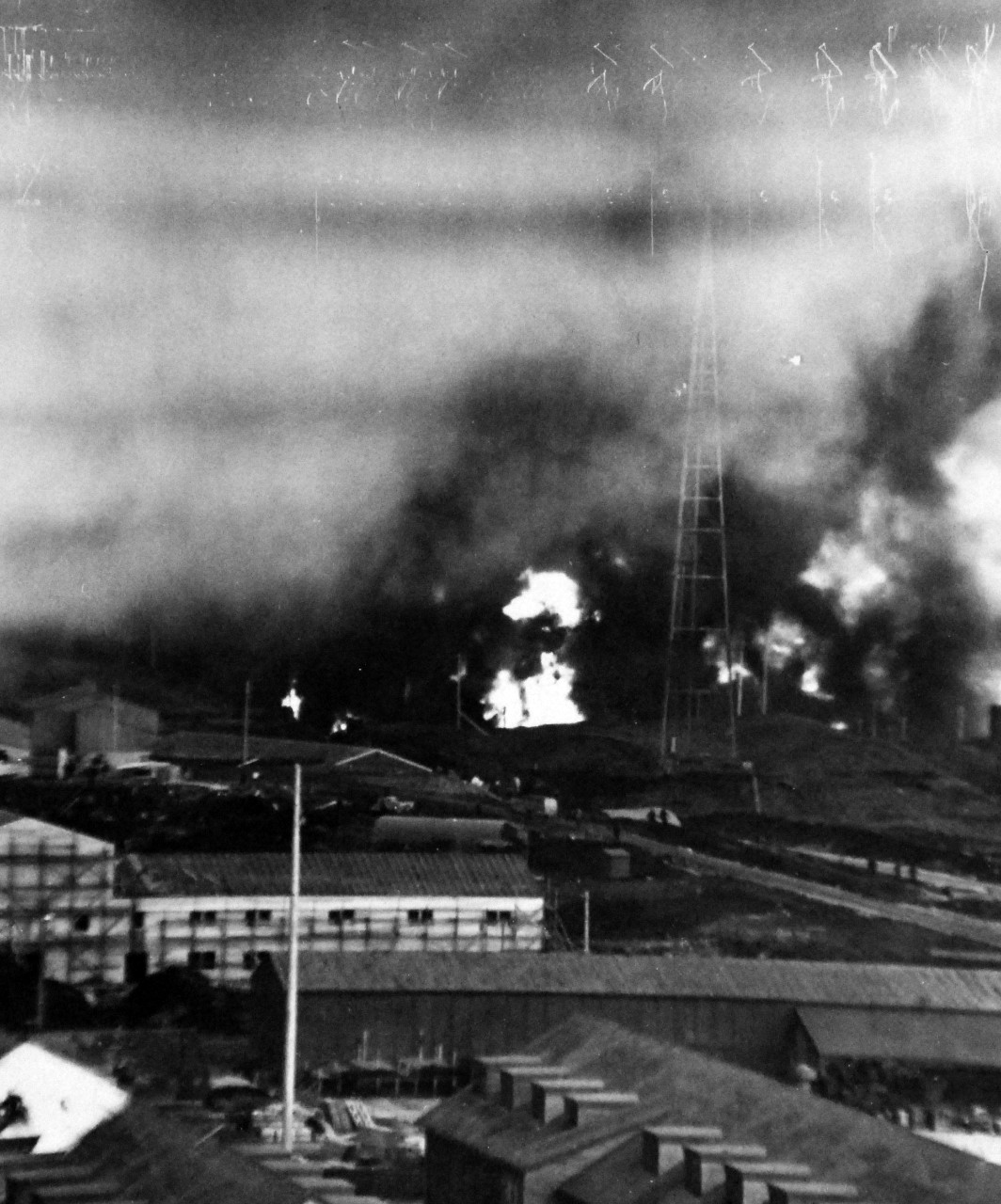 80-G-595:  Attack on Dutch Harbor,  Alaska,  June 1942.   Oil tanks burning after bombing, 4 June 1942.   Official U.S. Navy Photograph, now in the collections of the National Archives.    (2014/5/29).