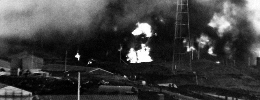 Image:  80-G-595:   Dutch Harbor, Alaska, June 4, 1942.   Oil tanks burning after Japanese bombing.   Official U.S. Navy Photograph, now in the collections of the National Archives.   (2014/05/29).
