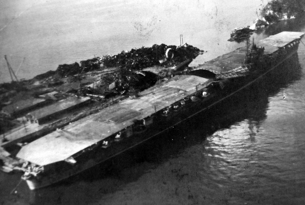 80-G-349907a:   Damaged Japanese ships in Kure Harbor, Japan.  Shown is Japanese aircraft carrier Katsuragi.   Photographed by aircraft from USS St. George (AV 16), 14 October 1945.  (6/19/2014). 