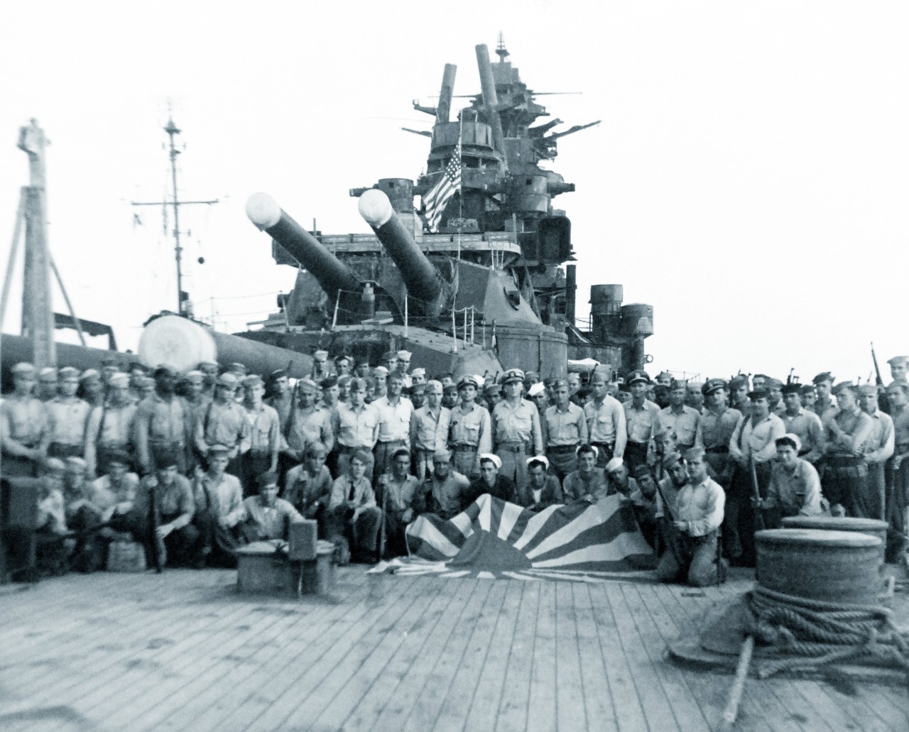 80-G-421082:   Japanese battleship Nagato, 1945.    On board the Japanese battleship Nagato at Japan.  U.S. Forces spread Japanese flag on deck.  Photographed by crew of USS Iowa (BB-61), August 1945.   Official U.S. Navy Photograph, now in the collections of the National Archives.   (2014/8/20). 
