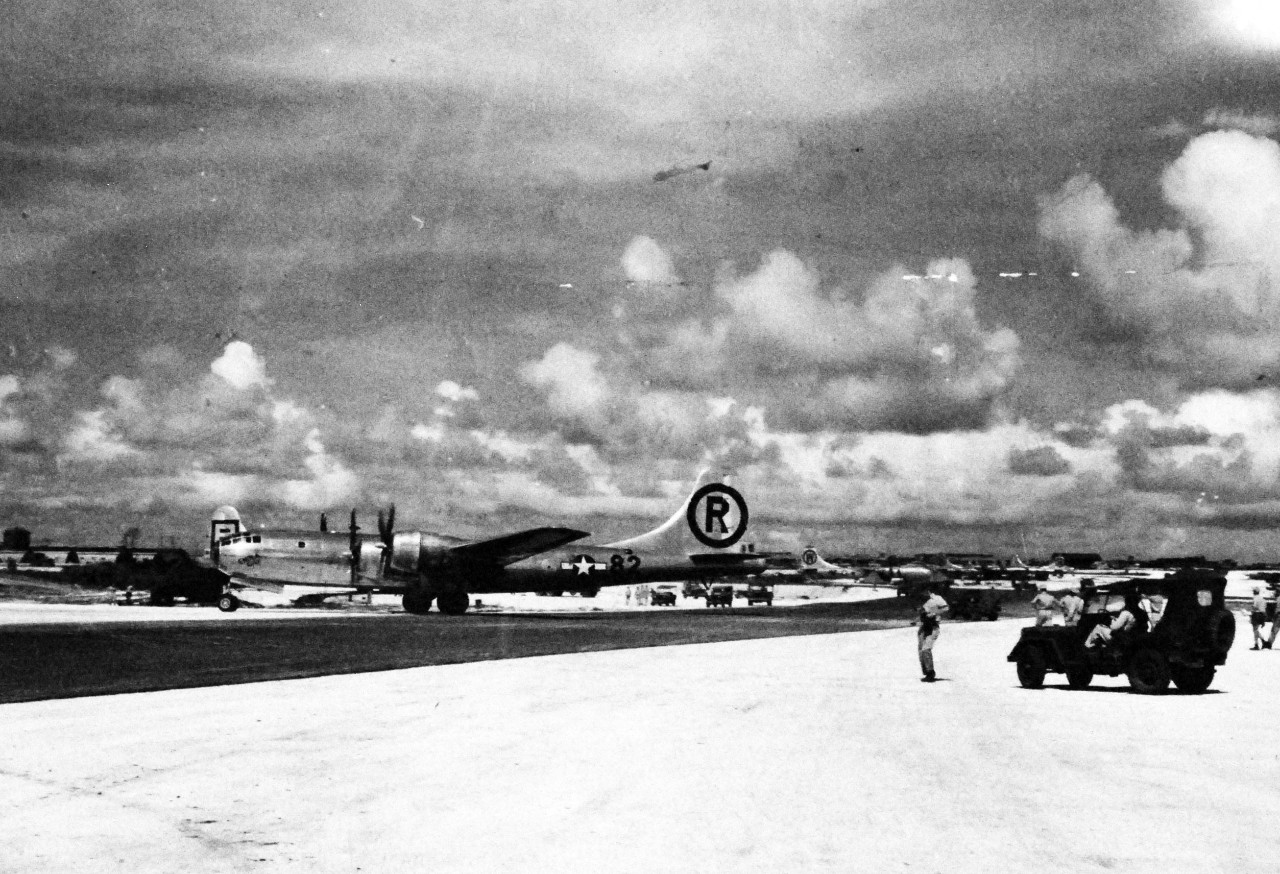 77-BT-91:   Tinian Island, August 1945.   Boeing B-29 Superfortress, Enola Gay, returns home after strike at Hiroshima, August 6, 1945, entering hard sand.  Official photograph of the Office of Chief of Engineers, now in the collection of the National Achives.   (2015/08/25). 