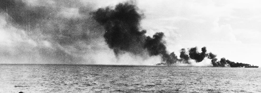 Image:  80-G-384160:  Battle of Leyte Gulf, October 1944.    Possibly USS Gambier Bay (CVE-73) receives attack by Japanese surface units, as seen from USS White Plains (CVE-66).   Official U.S. Navy Photograph, from the collections of the National Archives.  