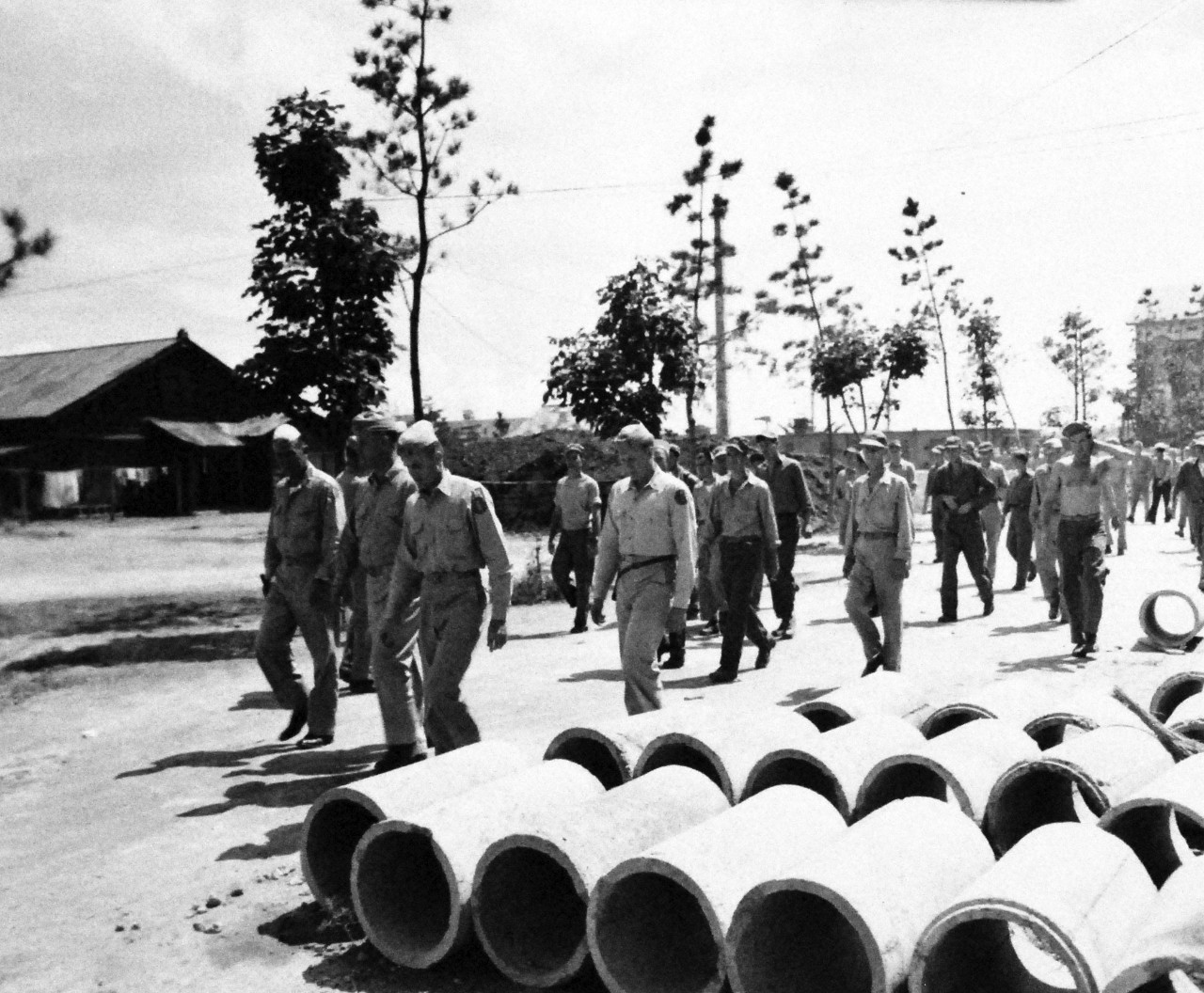 127-GW-1503-133807:   Prisoner of War Camp, Yokosuka, Japan, 1945.   General Clement leading Prisoners of War to chow, Yokosuka, Japan, September 6, 1945.   Photographed by Huddleston.   Official U.S. Marine Corps photograph, now in the collection of the National Archives.  (2014/6/5).  