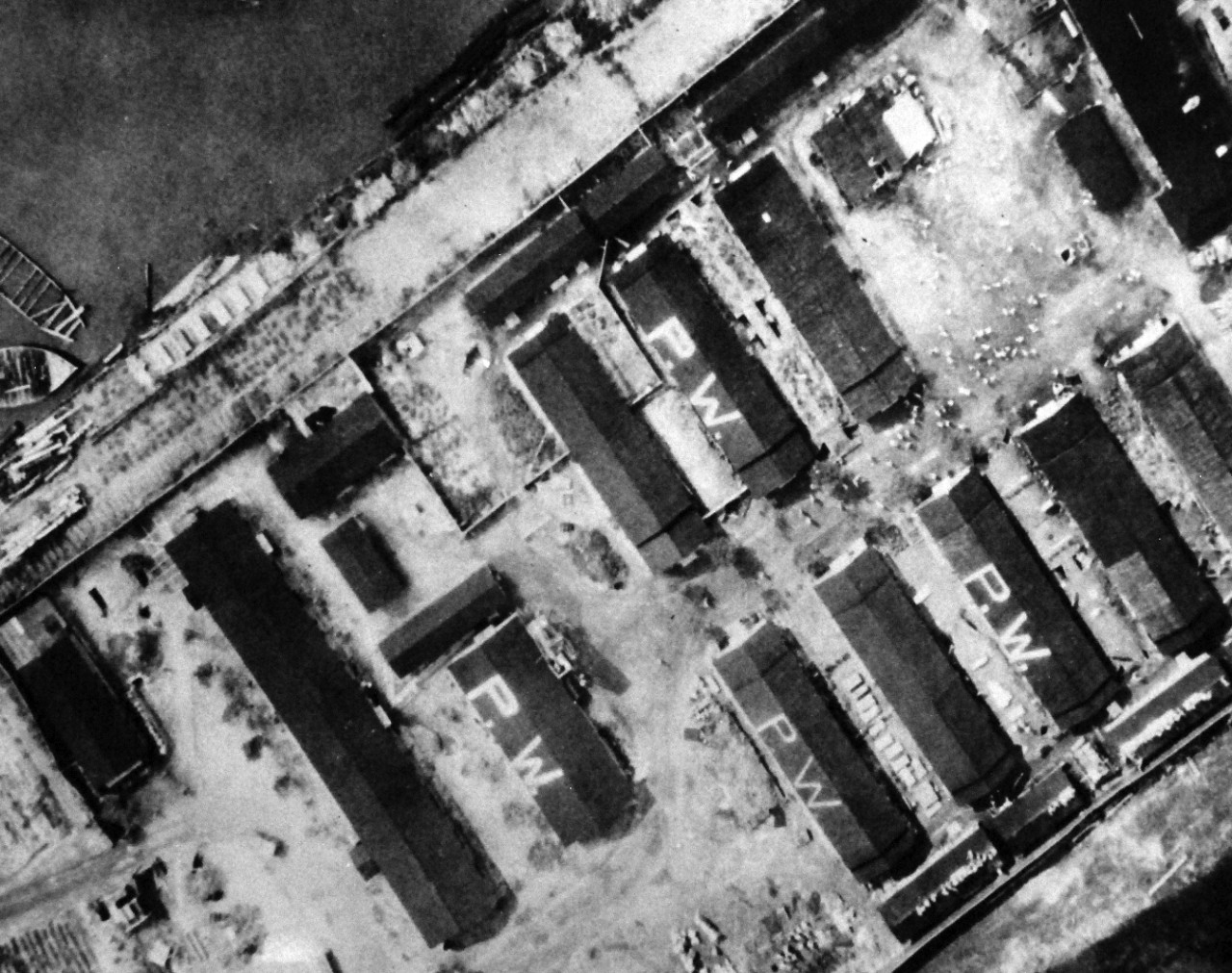 80-G-490389:  Allied Prisoner of War Camp, Tokyo, 1945.  Low aerial of Allied prisoners of war in Tokyo, Japan, area.  Note PW on the rooftops indicating prisoner of war.   Released August 29, 1945.   Official U.S. Navy Photograph, now in the collections of the National Archives.   (2015/11/10).