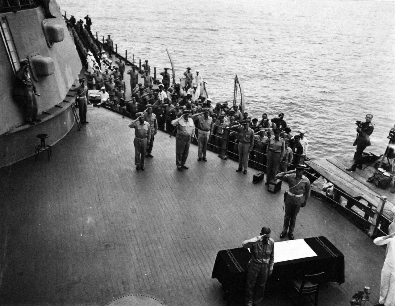 80-G-332665:  Formal Surrender of Japan, Tokyo Bay, September 2, 1945.  High-ranking officers of Allied nations and General Douglas A. MacArthur, Supreme Commander salute to flag flying on board USS Missouri (BB 63).  Photographed by PHOM1/C James M. Mull.  U.S. Navy photograph, now in the collections of the National Archives.    (2015/11/17). Note, the original is a very small photograph.   