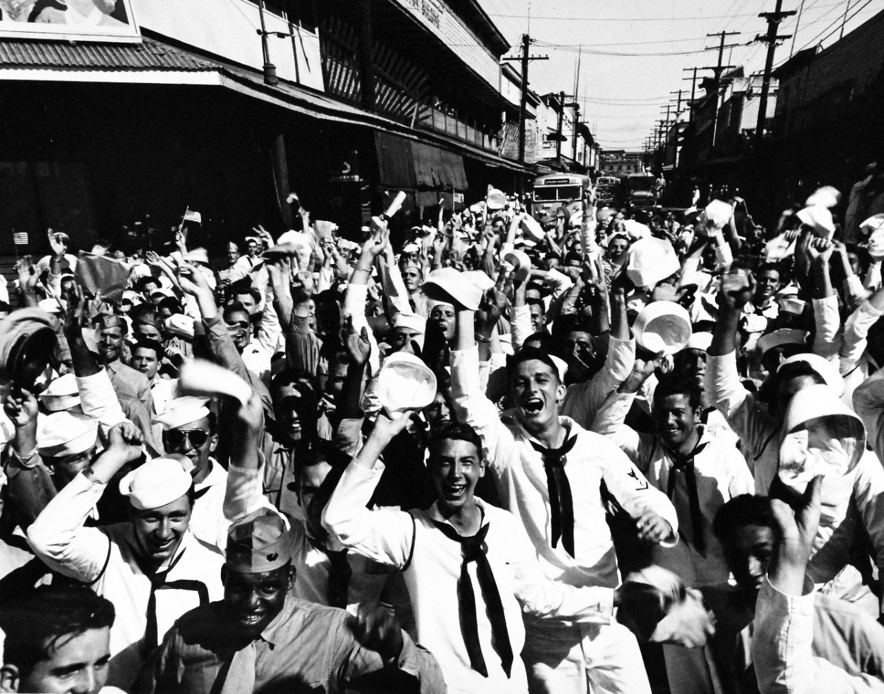 80-G-332789 V-J Day, August 15, 1945.    Scenes at Waikiki, Oahu, Territory of Hawaii, when word was received that the Japanese had accepted the Potsdam surrender terms, August 15, 1945.  Official U.S. Navy photograph, now in the collections of the National Archives. (2015/11/17).   Note, original photograph is extremely curved.  