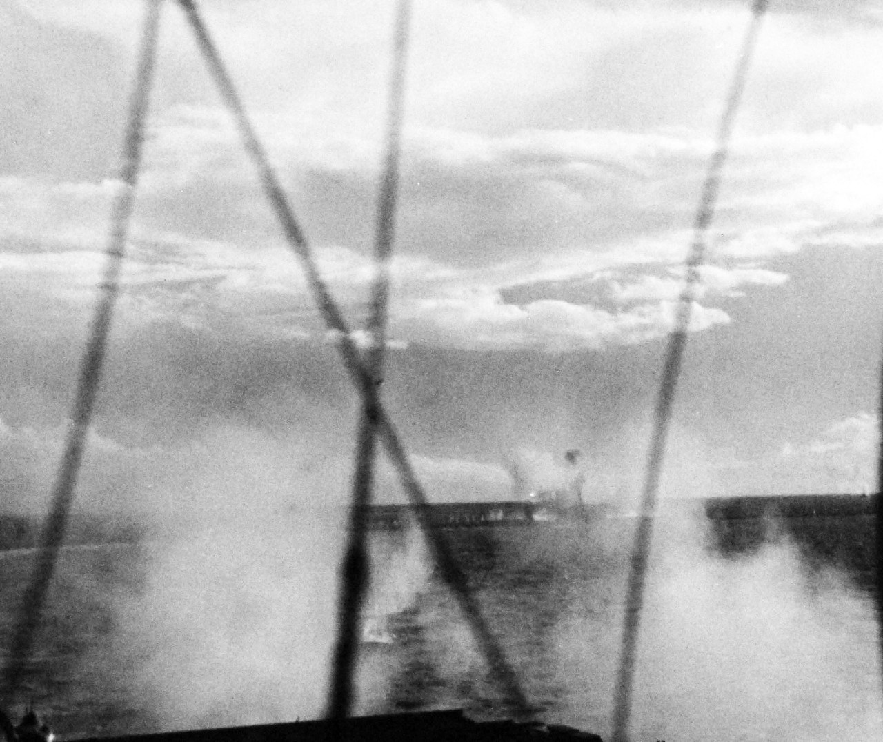 80-G-270625:  Battle off Samar, Japanese Kamikaze, October 25, 1944.    Anti-Aircraft Fire at a Japanese “Zero” during its attempt to make a suicide dive into the flight deck of USS Suwannee (CVE-27) at Leyte, Philippines, taken from USS Sangamon (CVE-26), 25 October 1944.  Official U.S. Navy Photograph, now in the collections of the National Archives.  (2014/4/24). 