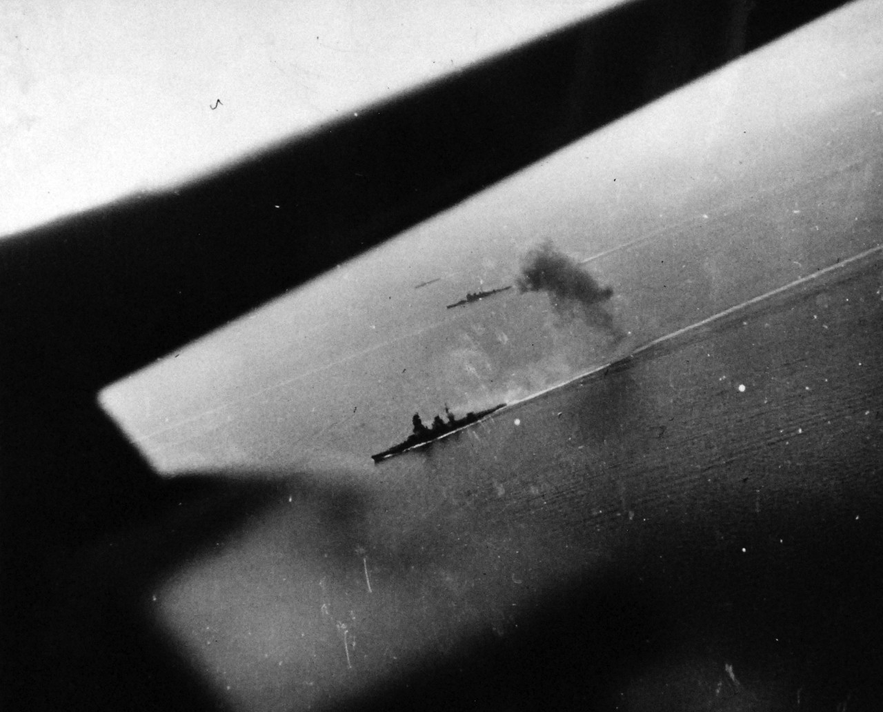 80-G-46988:  Battle off Samar, October 25, 1944.    Shown in aerial view are two Japanese warships: the heavy cruiser Chokai and the battleship Nagato.   Photograph released November 9,  1944.    Chokai was sunk during the battle.   Official U.S. Navy Photograph, now in the collections of the National Archives.   (2014/4/17).  