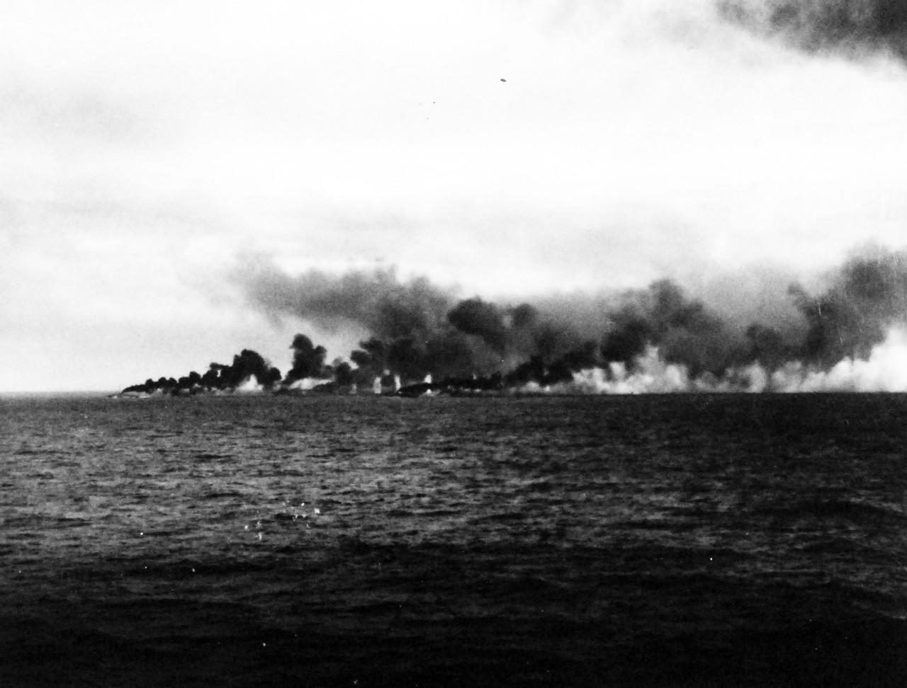 80-G-47038:   Battle off Samar, October 25, 1944.   Allied fleet is attacked by Japanese off Leyte.   Black smoke rising from funnels of CVEs.  Seen from USS Kitkun Bay (CVE 71).   DDs and Des lay smoke while being shelled by Japanese fleet.   Official U.S. Navy Photograph, now in the collections of the National Archives.  (2014/4/17).  