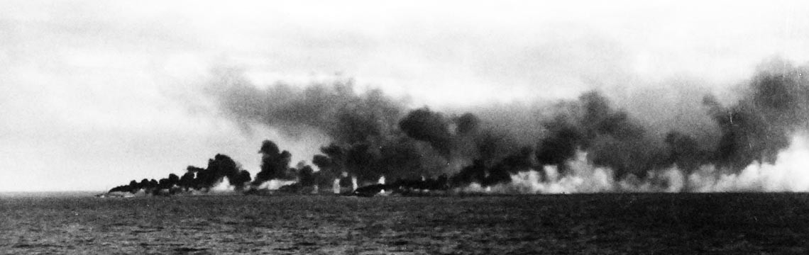 Image:  80-G-47038:   Battle off Samar, October 25, 1944.   Allied fleet is attacked by the Japanese off Leyte, Philippines.  Black smoke rising from funnels of the CVEs, naval escorts lay smoke while being shelled.   Official U.S. Navy Photograph, now in the collections of the National Archives.  