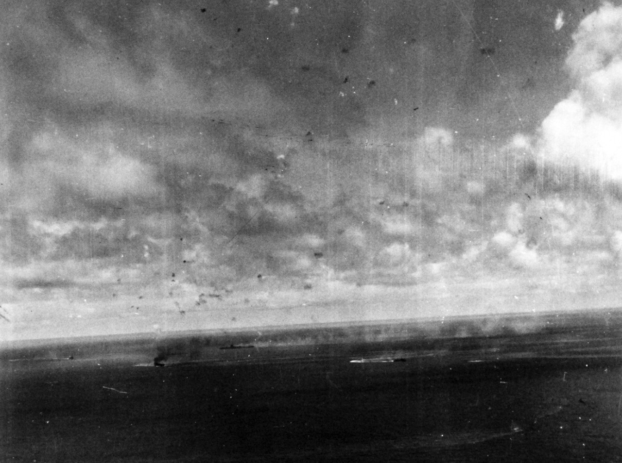 80-G-272556:   Battle of the Sibuyan Sea, October 24, 1944.  Japanese warships under attack by carrier-based planes at Northeast Luzon.  Note the aircraft carrier of the Shokaku class.  Zuikaku is in the background.  The carriers are burning.  Note, the Japanese heavy burst of anti-aircraft fire overhead.  Taken from by a plane from USS Franklin (CV-13), 24 October 1944.    Official U.S. Navy Photograph, now in the collection of the National Archives.   (2014/5/15).