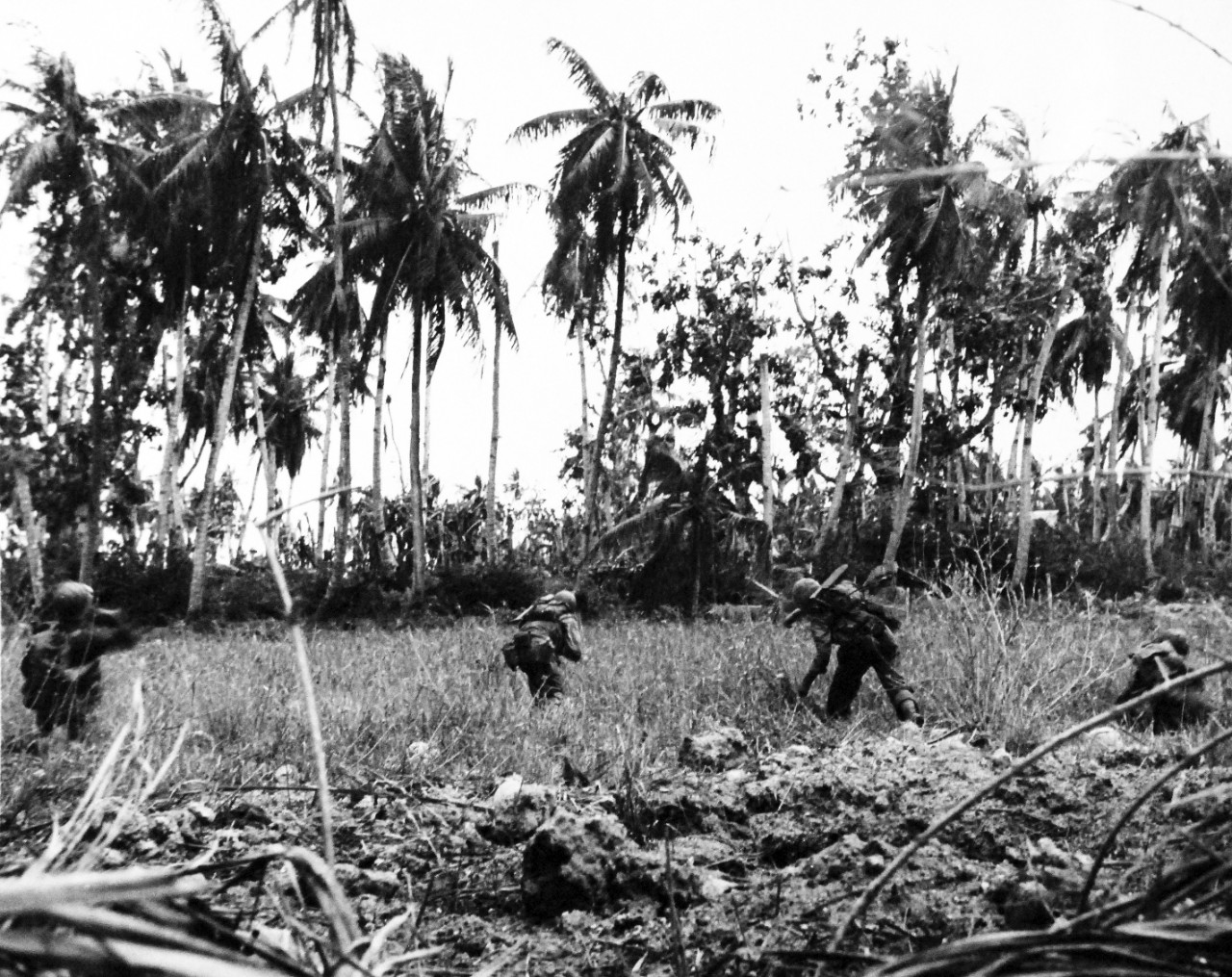 80-G-239420:  Invasion of Guam, July 21-August 10, 1944.   U.S. Marine Corps hurling hand grenades at Japanese troops on the other side of a Guam rice paddy, released August 3, 1944.    Official U.S. Navy Photograph, now in the collections of the National Archives.  (2017/03/07).