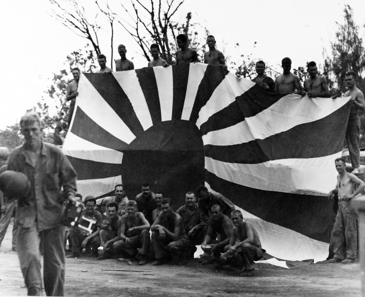 80-G-287222:   Invasion of Saipan, June-July 1944.  Large Japanese flag captured by U.S. Forces on Saipan, July 9th.  Photographed by USS Indianapolis (CA-35) photographer.   Official U.S. Navy Photograph, now in the collections of the National Archives.  (2017/03/21).  