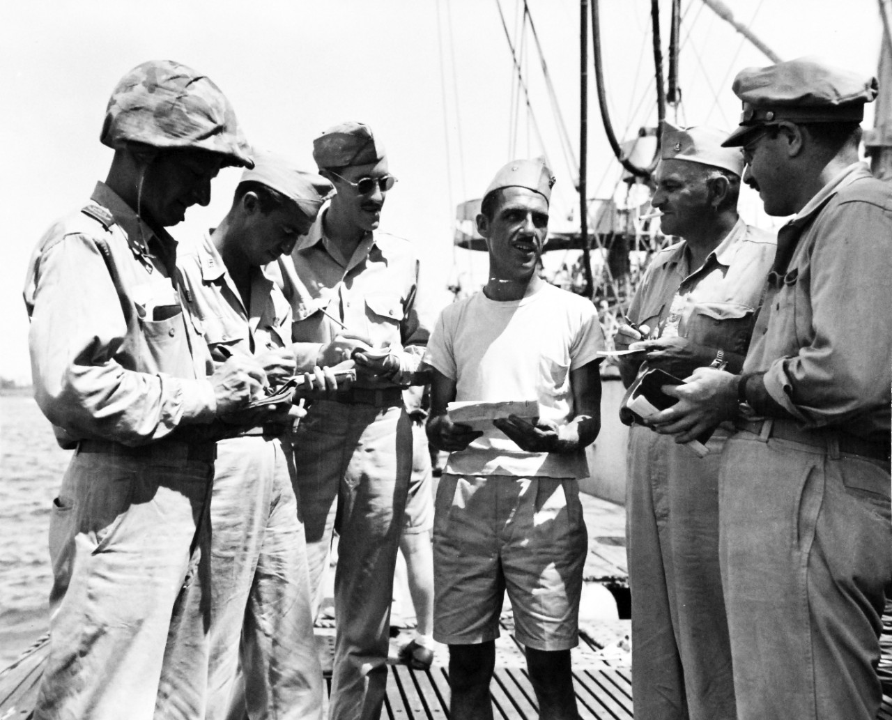 80-G-307703:  Invasion of Saipan, June-July 1944.   USS Cavalla (SS-244) during invasion operations.  The Captain, Lieutenant Commander Herman J. Kossler, USN, is being interviewed, June 1944.  Received March 20, 1945.      Official U.S. Navy Photograph, now in the collections of the U.S. Navy.  (2017/04/11).  