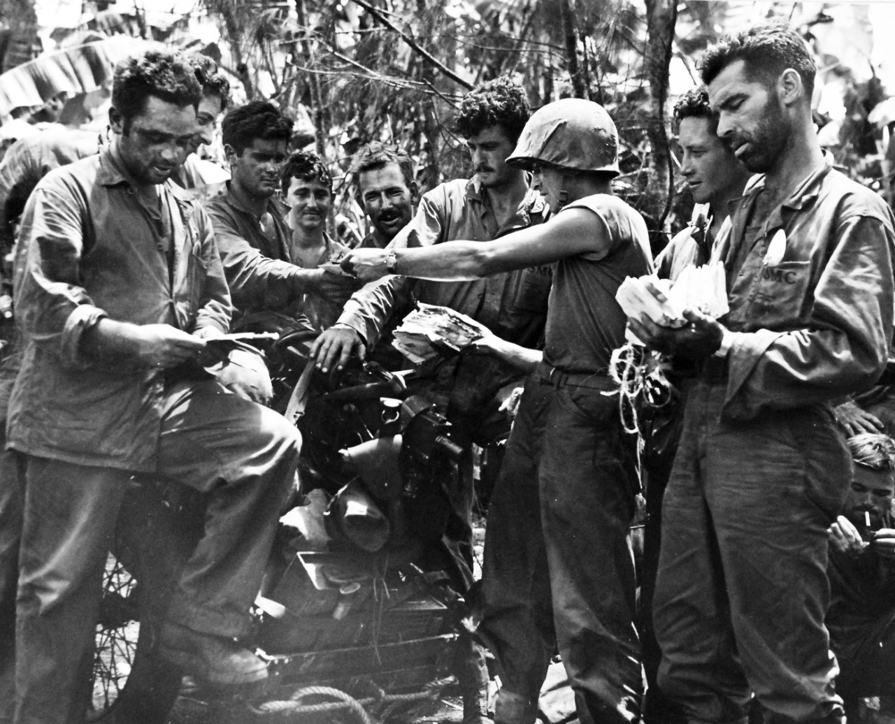 80-G-239321:  Invasion of Tinian, July-August 1944.      “Mail Call” on Tinian Island.  It took two Marines to hand out the first lot of mail that arrived, a week after the “Leathernecks” did, released August 5, 1944.    Official U.S. Navy photograph, now in the collections of the National Archives.  (2017/03/07).