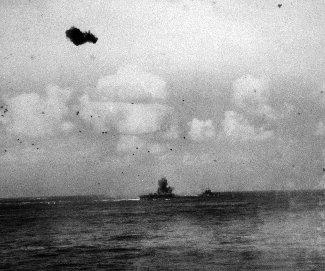 80-G-373774:   Okinawa Campaign, Pre-Landing Bombardment, Japanese Kamikaze, March 1945.     Near miss by Japanese plane on USS Bataan (CVL-29), unit of Task Force off Okinawa in the Ryukyu Islands.   As seen from USS Essex (CV-9), March 17, 1945.    Official U.S. Navy Photograph, now in the collection of the National Archives.   (2014/5/8).   