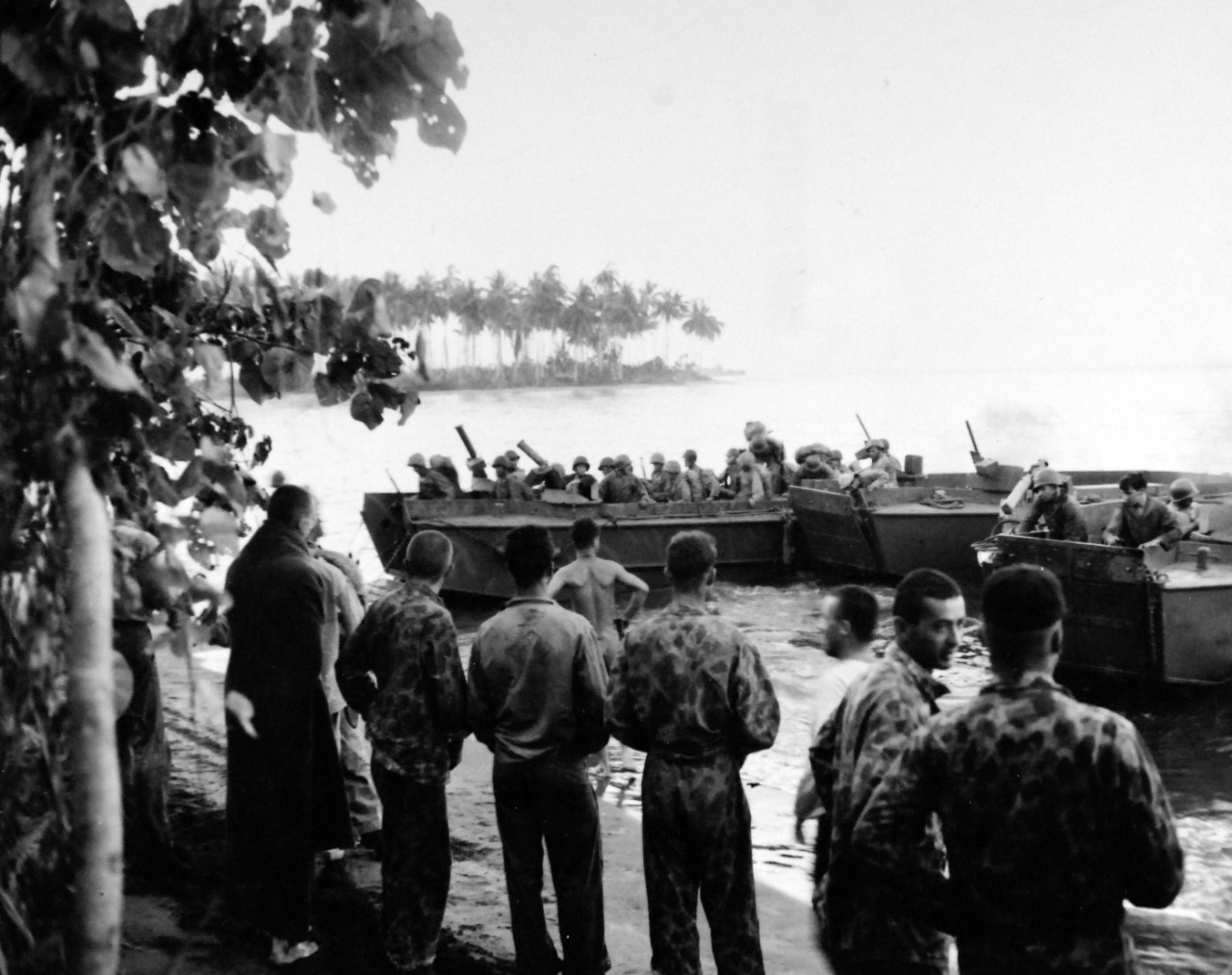 80-G-202482:  Bougainville Campaign, November 1943-August 1945.     Putting men and supplies ashore at Empress Augusta Bay, Bougainville Island.  Shown:  U.S. Marine troops (21st Battalion) in LCP’s as they hit the beach at Torgina Point.  Photographed November 6, 1943.  Official U.S. Navy Photograph, now in the collections of the National Archives.  (2018/02/21).  