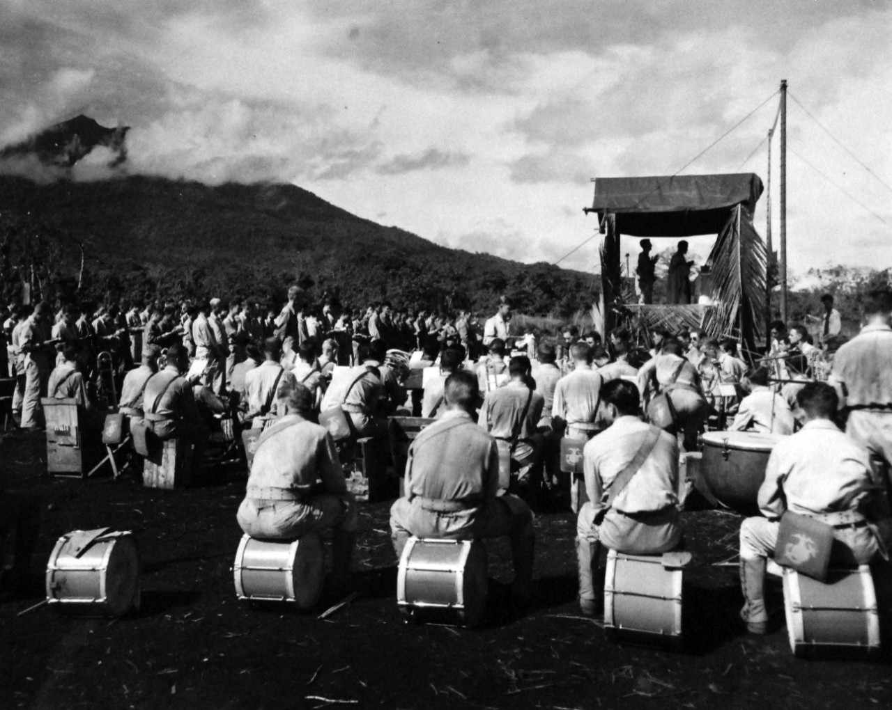 127-GW-983-83832: Battle of Cape Gloucester, New Britain, December 1943-January 1944.   “Easter Sunday on New Britain”  A Marine military band takes the place of an organ for Easter Sunday Mass held on Cape Gloucester, New Britain.  Photographed by Howard, 9 April 1944.   Official U.S. Marine Corps Photograph, now in the collections of the National Archives.   (2014/7/9).