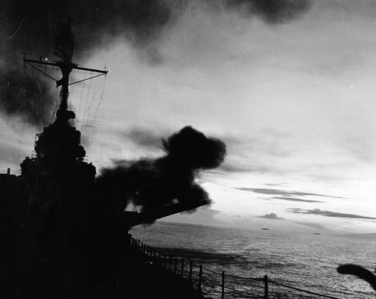 80-G-57446: Bombardment of Cape Gloucester, New Britain by the guns of USS Phoenix (CL-46), December 24-26, 1943.  Official U.S. Navy Photograph, now in the collection of National Archives (2018/04/25). 