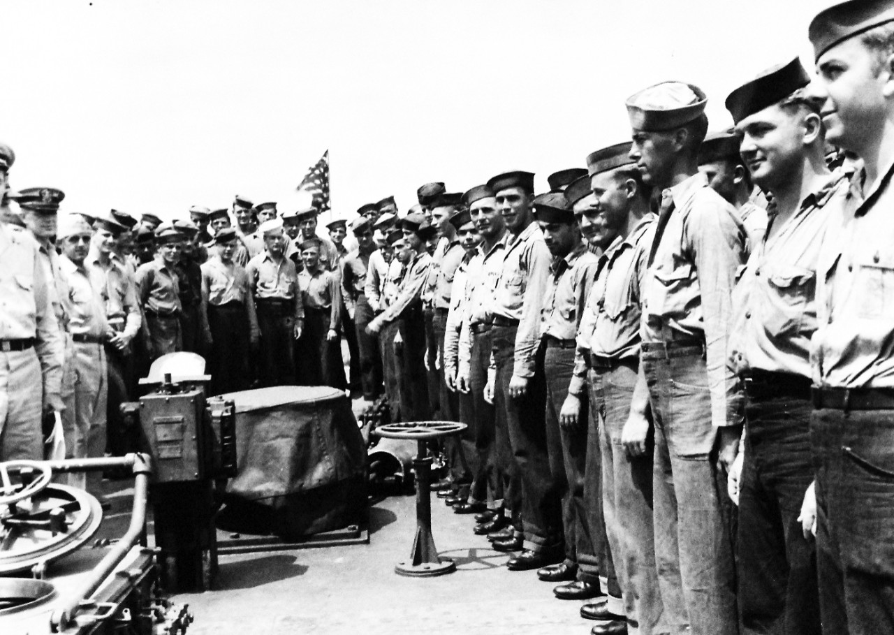 USS O’Bannon (DD-450), 1943.   Officers and enlisted men onboard USS O’Bannon (DD-450) after ceremony in which Commander Donald J. MacDonald, Commanding Officer, was awarded the Navy Cross and his crew was commanded for their gallant performances in the Battle of Kula Gulf, July 5-6, 1943.  Photograph released November 18, 1943.  U.S. Navy photograph, now in the collections of the National Archives.  (2016/06/28).