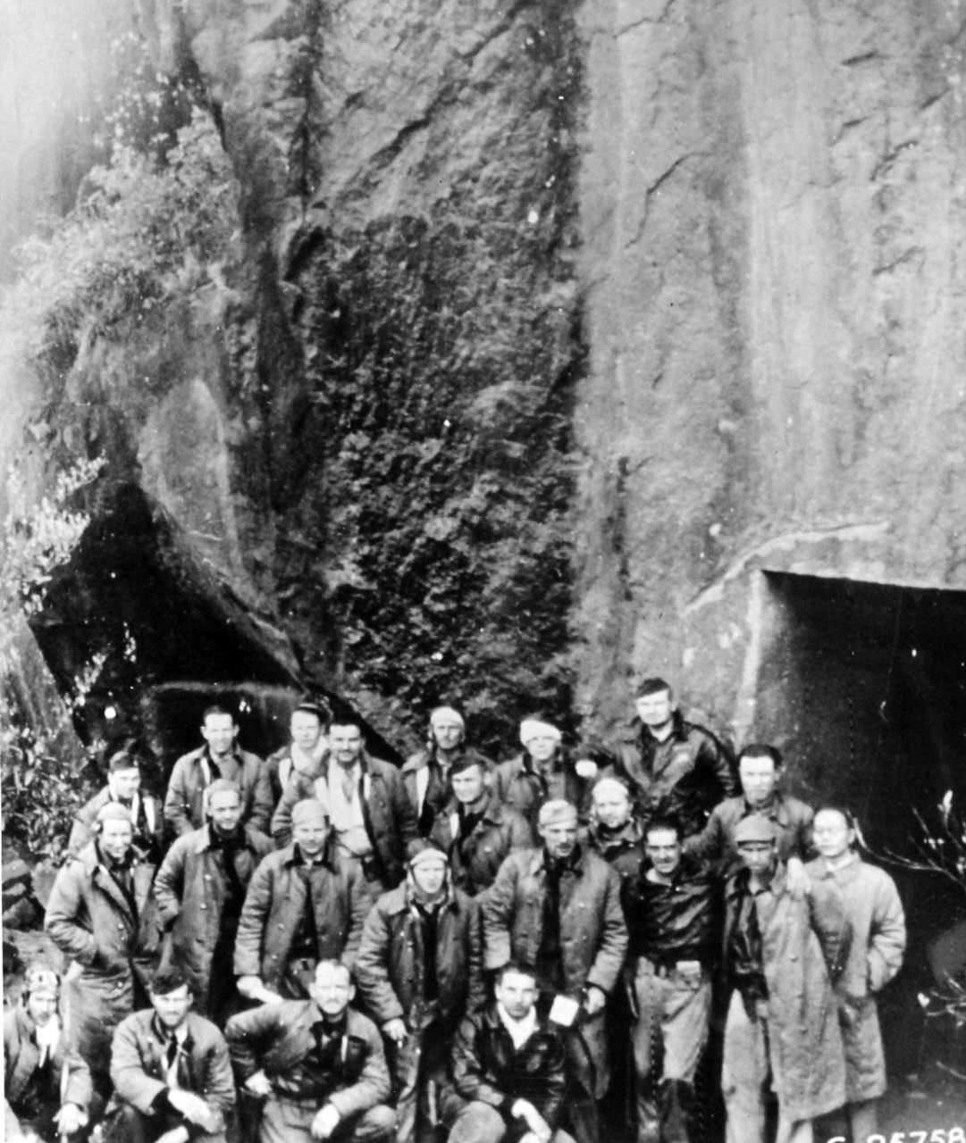 111-SC-25758AC:   Doolittle Raid on Japan, April 18, 1942.  Major General James Doolittle’s Tokyo Raiders are grouped outside the shelter carved from the mountainside.  They lived there for 10 days after assembling from their Chinese Mountain retreats.      U.S. Army photograph, now in the collections of the National Archives.  (2017/05/02).