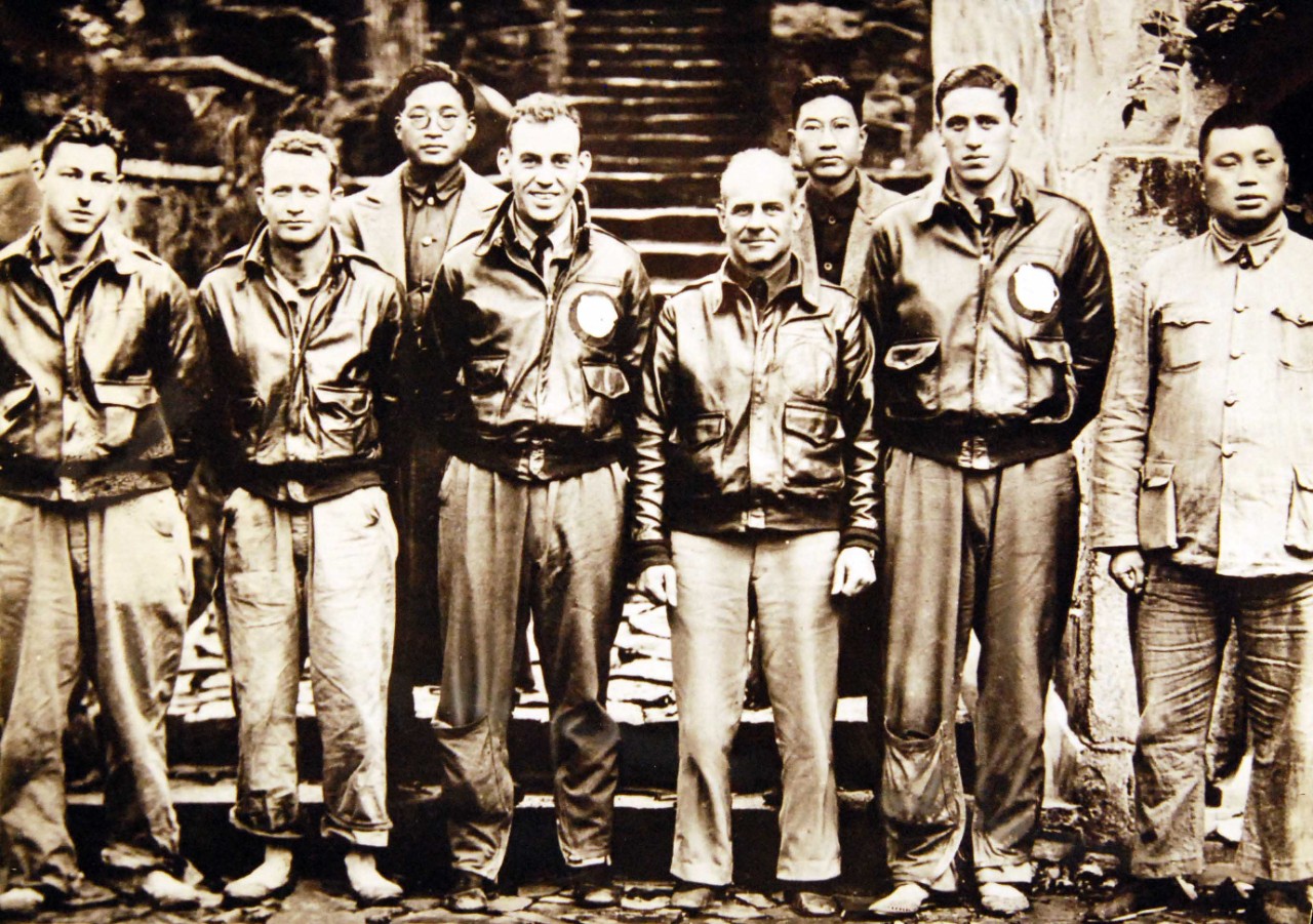208-N-9092-P:  Doolittle Raid on Japan, April 1942.  Lieutenant Colonel James H. Doolittle, USAAF, (center) with members of his flight crew and Chinese officials in China after the 18 April 1942 attack on Japan. Those present are (from left to right): Staff Sergeant Fred A. Braemer, Bombardier; Staff Sergeant Paul J. Leonard, Flight Engineer/Gunner; General Ho, director of the Branch Government of Western Chekiang Province; Lieutenant Richard E. Cole, Copilot; Lt.Col. Doolittle, Pilot and mission commander; Henry H. Shen, bank manager; Lieutenant Henry A. Potter, Navigator; Chao Foo Ki, secretary of the Western Chekiang Province Branch Government.   Also at NHHC as NH 97502.   Office of War Information Photograph, now in the collections of the National Archives.  (2017/05/02).