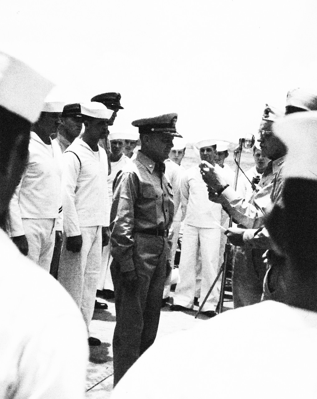 80-G-40170:    Commander Arnold E. True, USN.  Receives the Navy Cross and Distinguished Service Medal for his performance while in command of USS Hammann (DD-412) during the May-June 1942 Battles of Coral Sea and Midway. Hammann was lost on 6 June 1942, during the Midway action.  Presenting the awards is Admiral William F. Halsey. Photograph was taken circa October 1942.   Official U.S. Navy Photograph, now in the collections of the National Archives.  (2015/10/20).