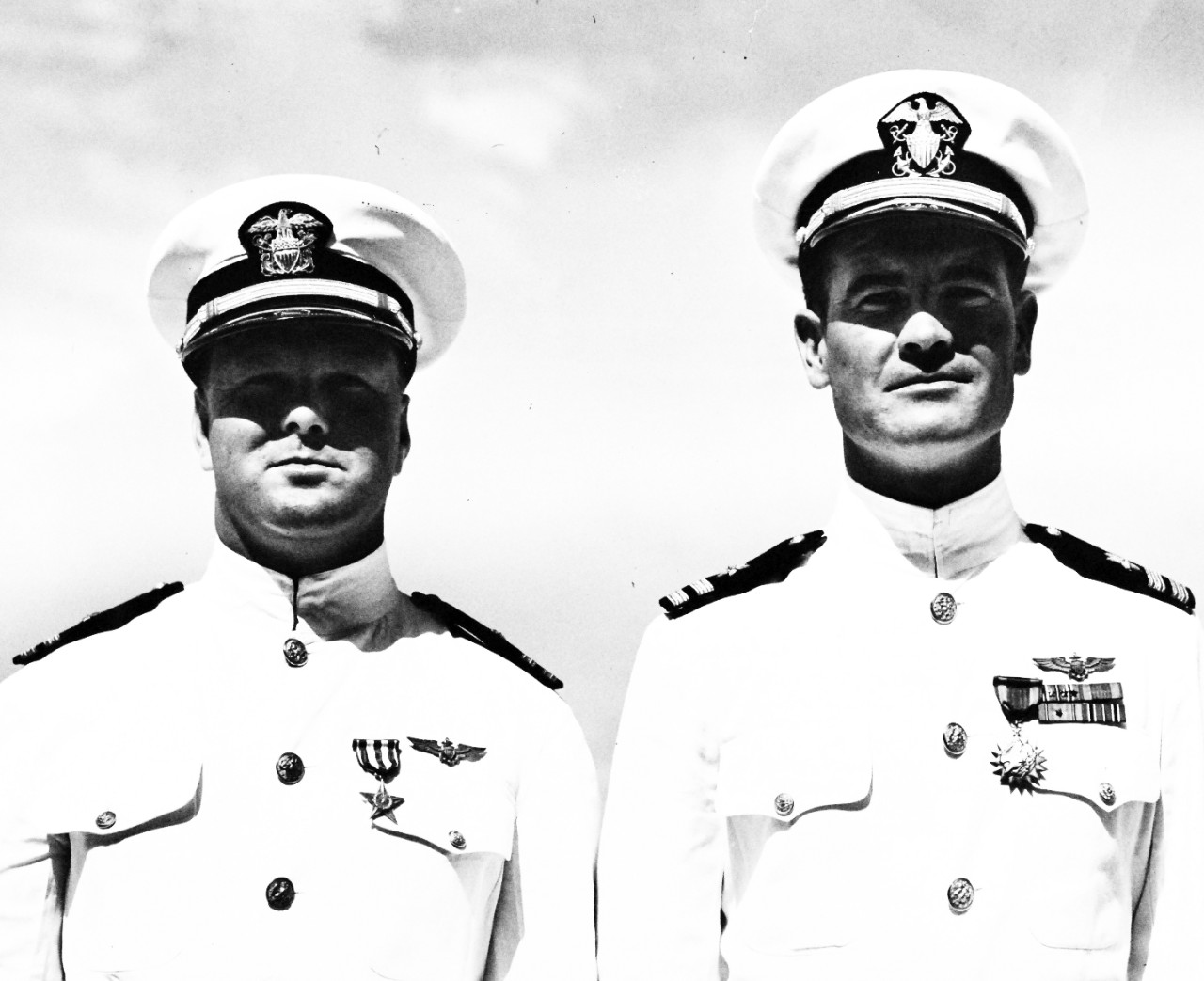 80-G-42692:  Lieutenant August A. Barthes, USN, and Lieutenant Joseph M. Kellam, USN, Silver Star.    Naval Operating Base, Bermuda, after the presentation of awards by Rear Admiral I.C. Sowell, Lieutenant Joseph M. Kellam (left) who received the Silver Star for gallantry in action in the South Pacific Lieutenant Joseph M. Kellam, USN, (left) who received the Silver Star for gallantry in action in the South Pacific and Lieutenant August A. Barthes, who was awarded the Air Medal for bravery in the Battle of Midway, June 12, 1943.    Official U.S. Navy Photograph, now in the collections of the National Archives.   (2017/08/01).  